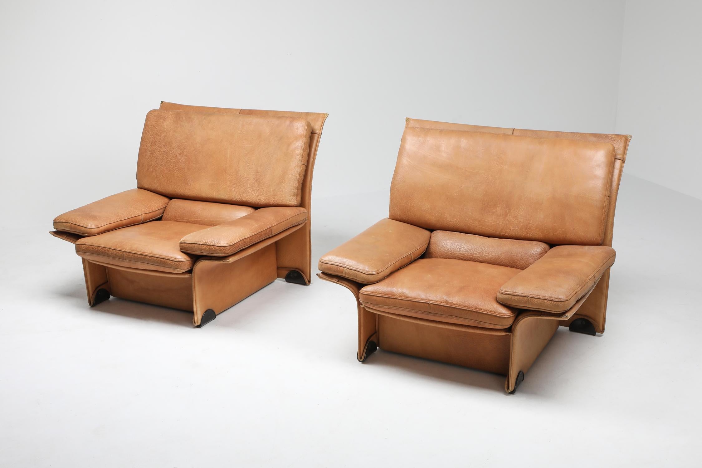 Buffalo leather edition designed by Titiana Ammannati & Giampiero Vitelli in 1976 for Brunati, Italy.
This pair of lounge chairs combines great design, the best quality of materials, and amazing comfort.
Fits well in a Scandinavian of Brazilian
