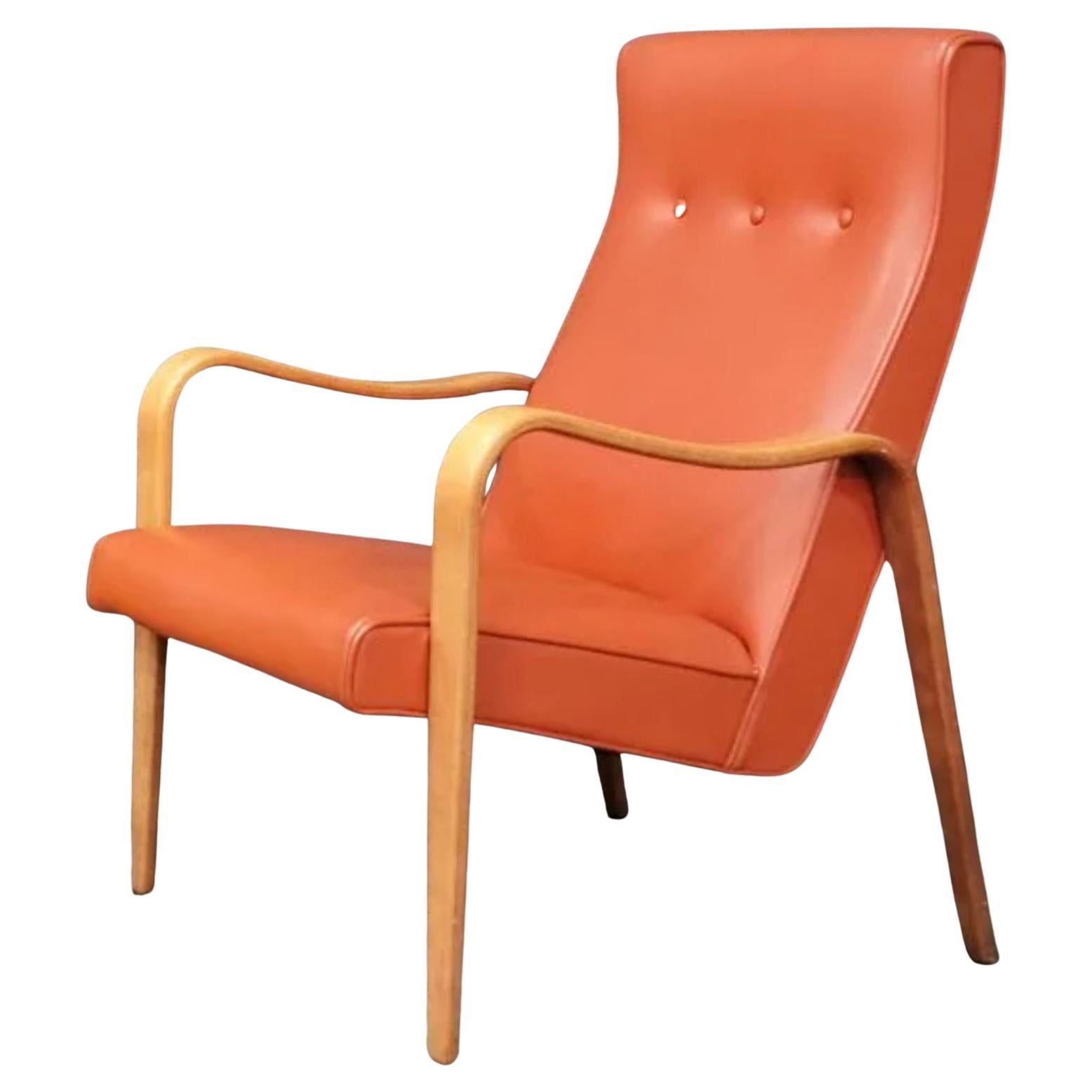 (1) Mid-Century Modern Thonet bentwood birch lounge armchair. Has original medium pastel Reddish Orange color vinyl upholstery. Great vintage condition. Timeless chair design by Thonet. Curved birch bentwood arms. Located in Brooklyn NYC.

24