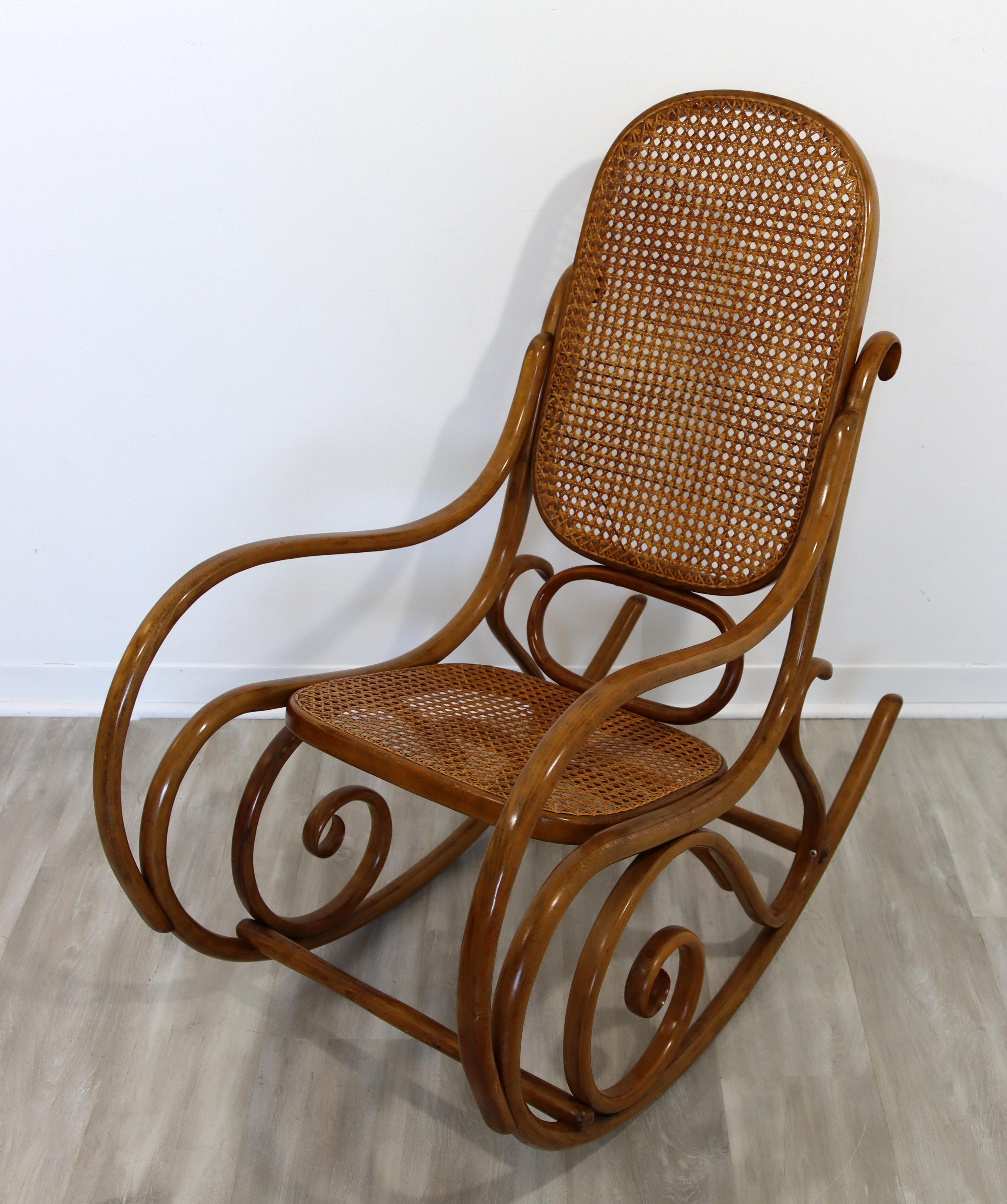 For your consideration is a magnificent, Schaukelstuhl rocking chair, with a cane back on bentwood, by Michael Thonet, circa the 1970s. In excellent vintage condition. The dimensions are 20.5