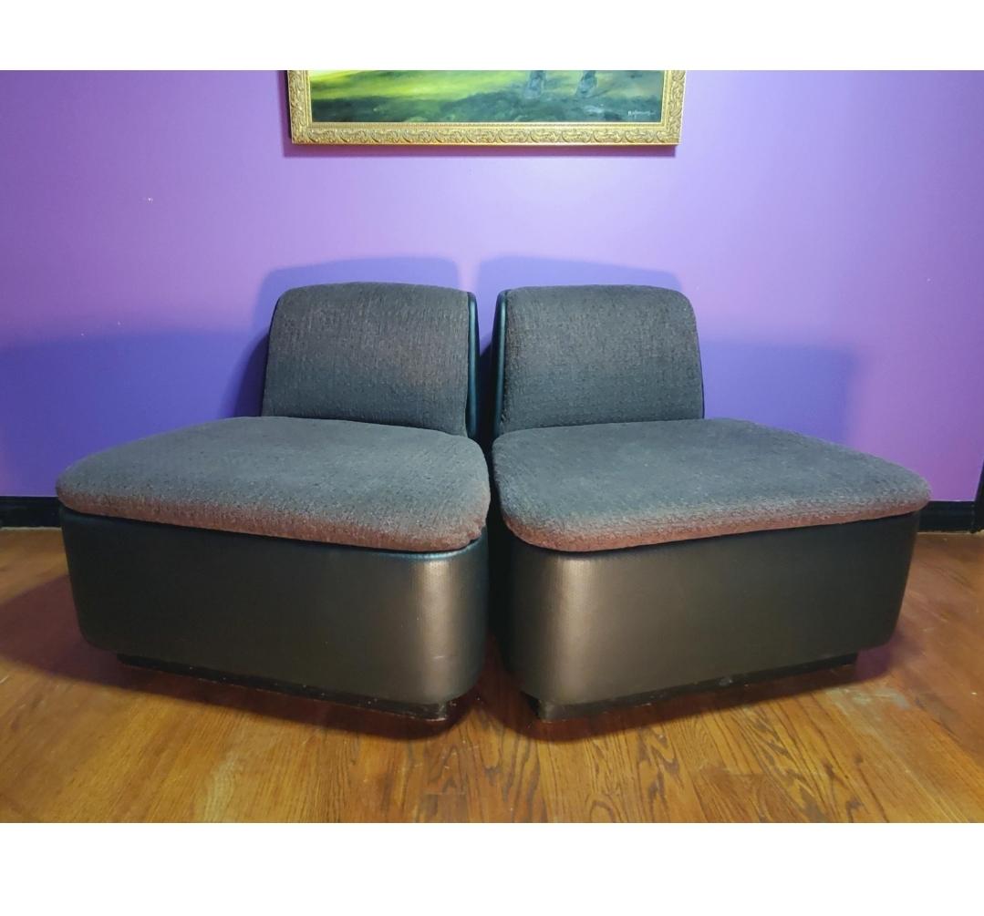 D.O.B. October 8th 1964
Pair of Thonet lounge slipper chairs.
Stunning chrome trim around the back.
Ebonized wood base.
Nailhead trim on back.
Dark eggplant tinted grey tweed fabric on the seats and back cushion with charcoal black perforated