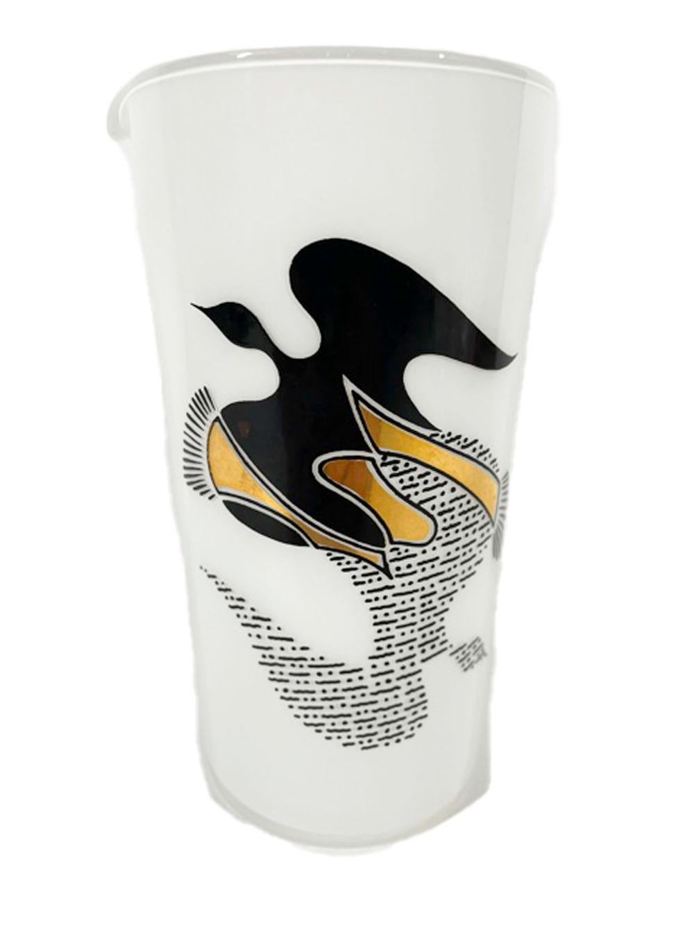 Three-piece Mid-Century Modern cocktail set with a stylized dove in black enamel and 22 karat gold above another in black dots and dashes flying in the opposite direction all on clear glass with white frosted interior. The set consists of a cocktail