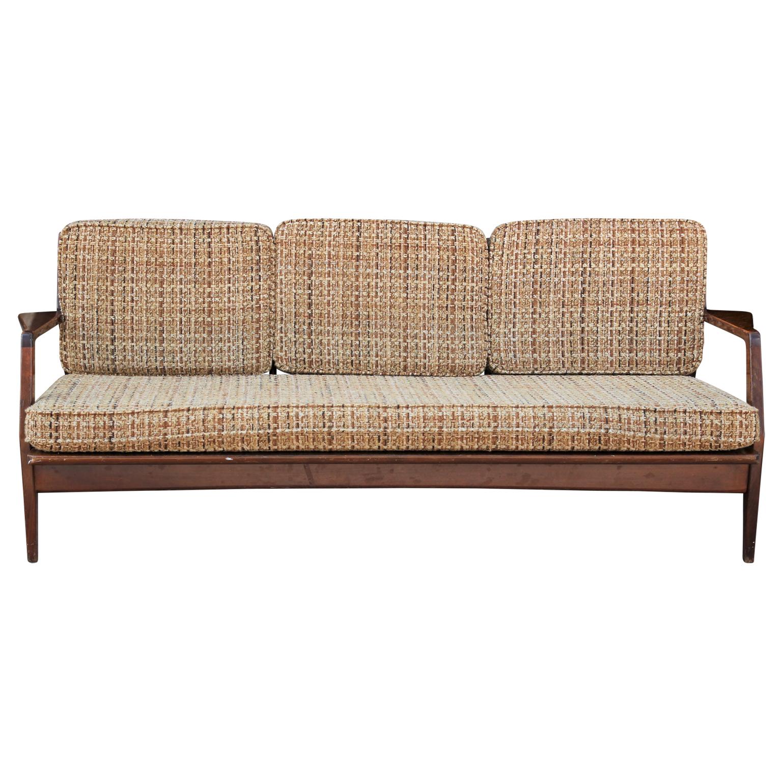 Modern Danish Ib Kofod-Larsen slat back walnut color sofa. COM ready. Original upholstery is in nice vintage condition. Frame should be restored for perfection.