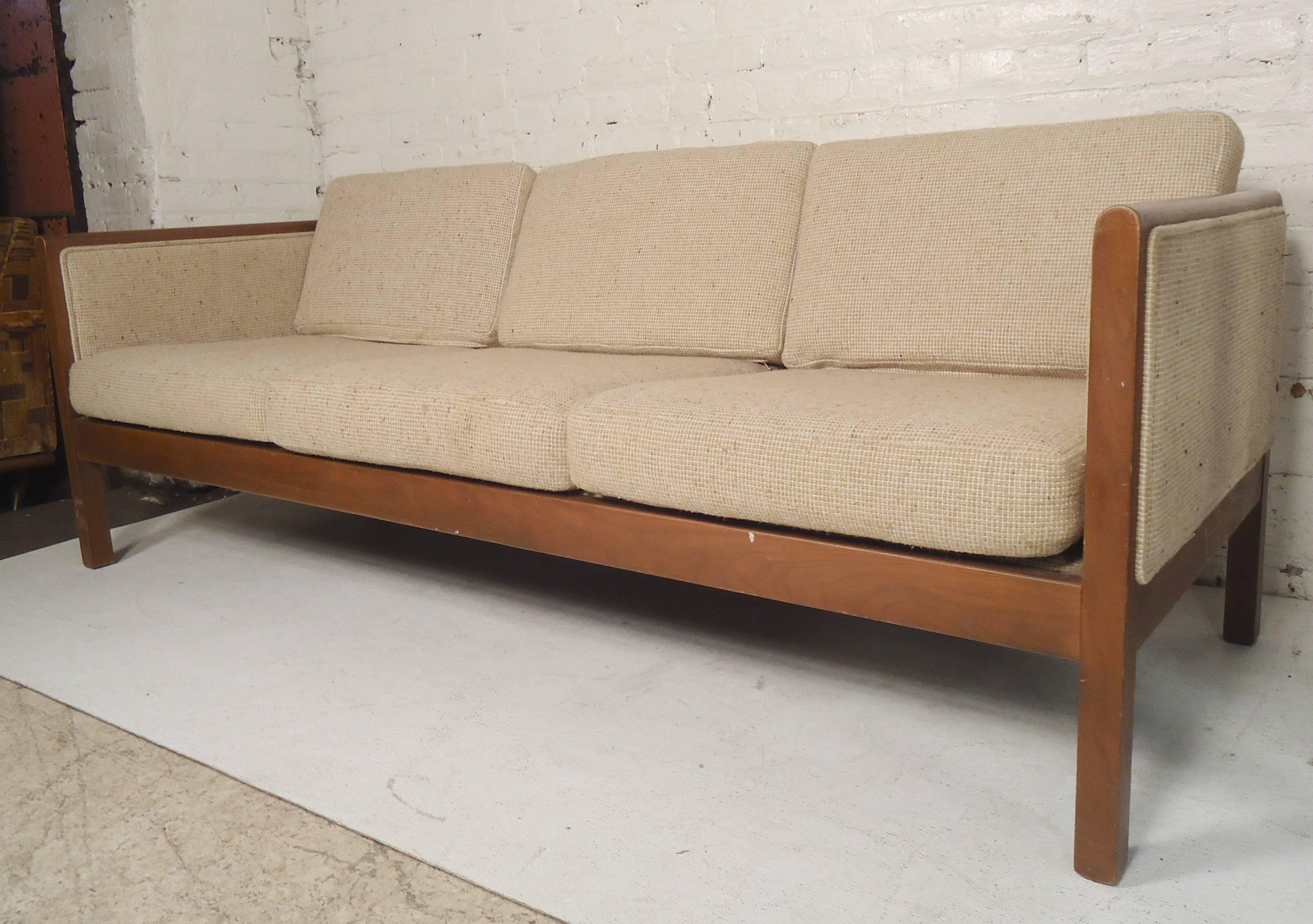 Vintage sofa with walnut trim and upholstered back.

(Please confirm item location - NY or NJ - with dealer).
      