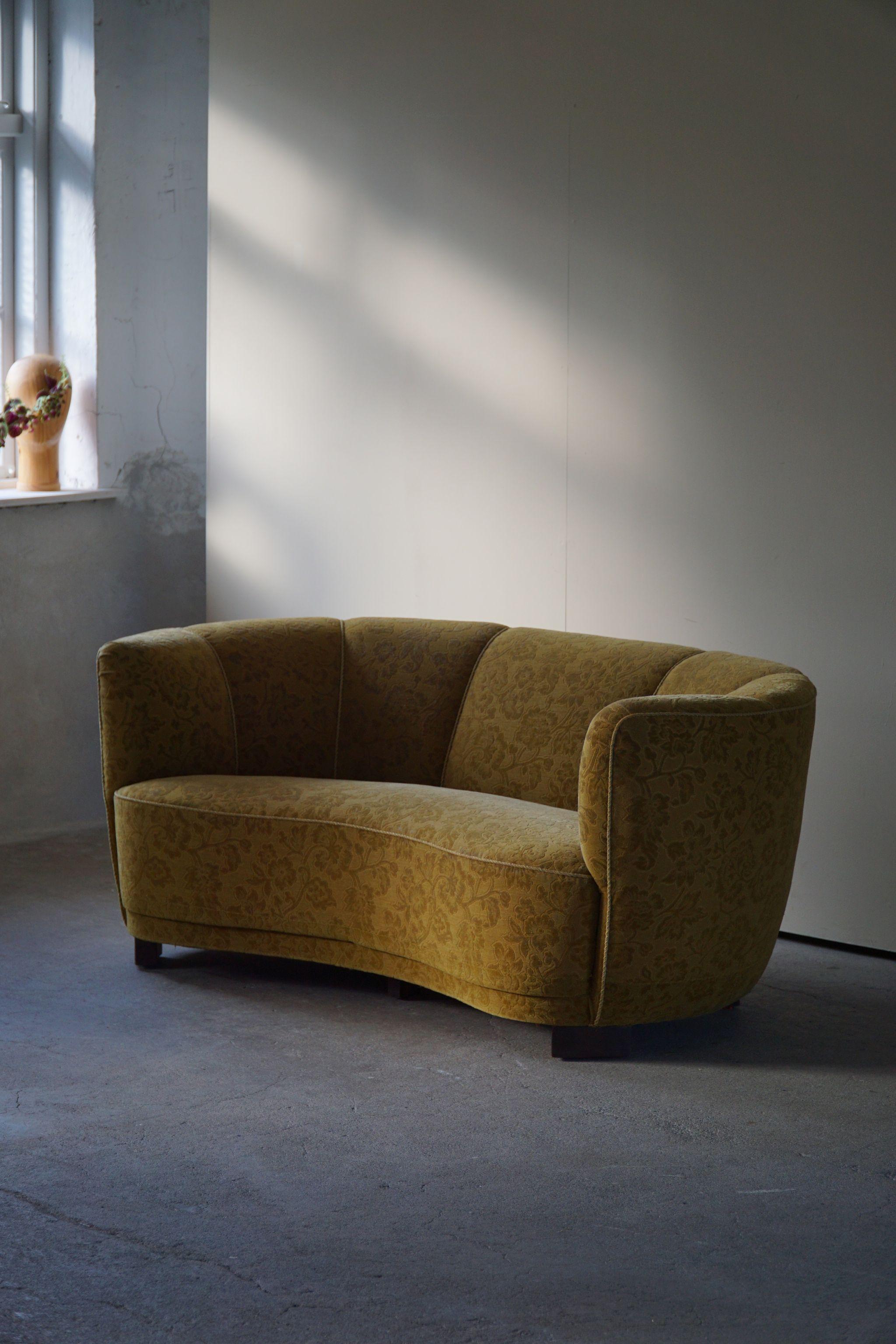 Curved great quality banana sofa with chunky legs in its original fabric. Made by a Danish cabinetmaker in the 1940s. Shapes are on point and have an intriguing look that fits nicely into a modern interior This classic banan sofa will complement