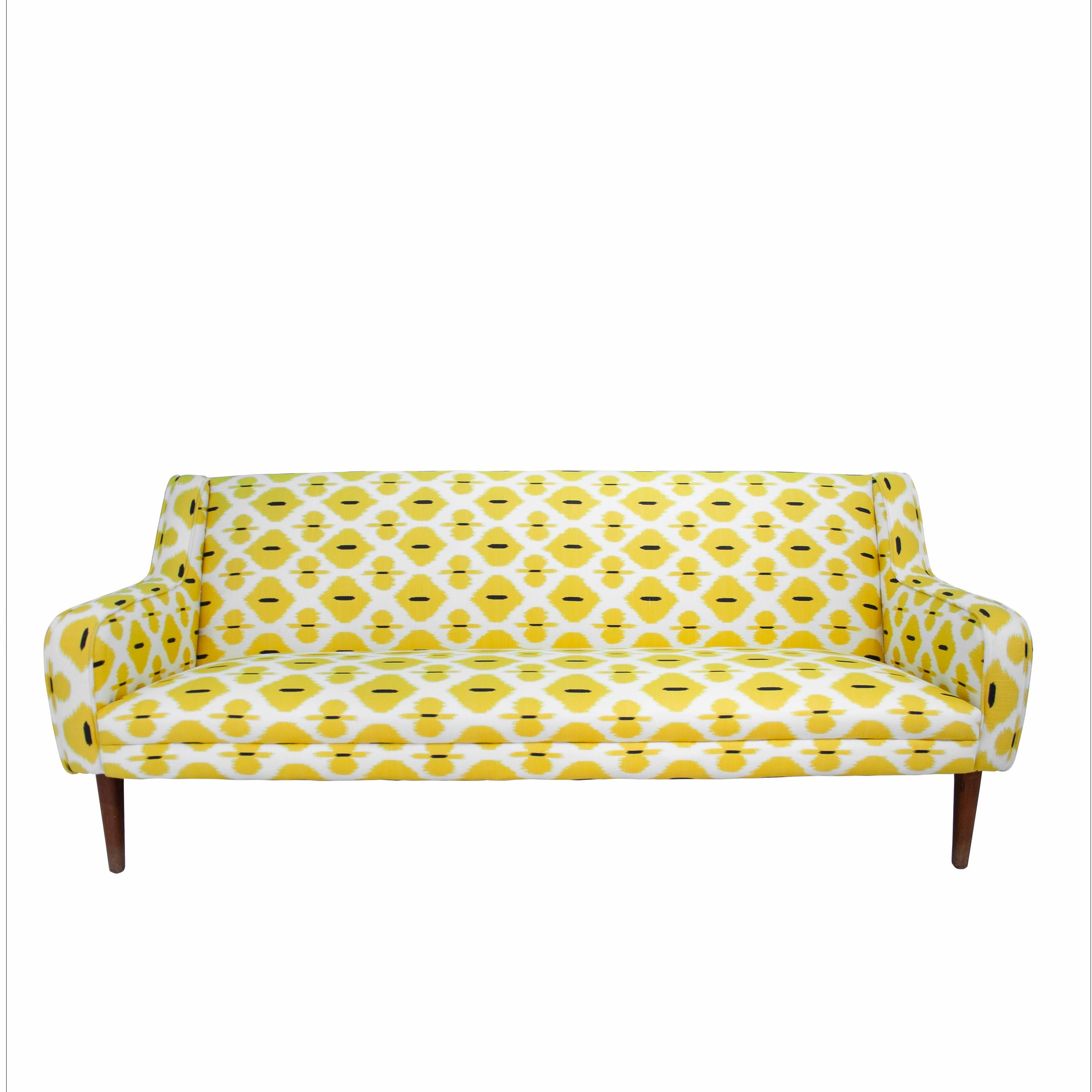 Midcentury Italian Sofa made with Teak-wood structure, with handcrafted reupholstery in linen and cotton fabric with yellow motifs, and conical wooden legs, 1950.