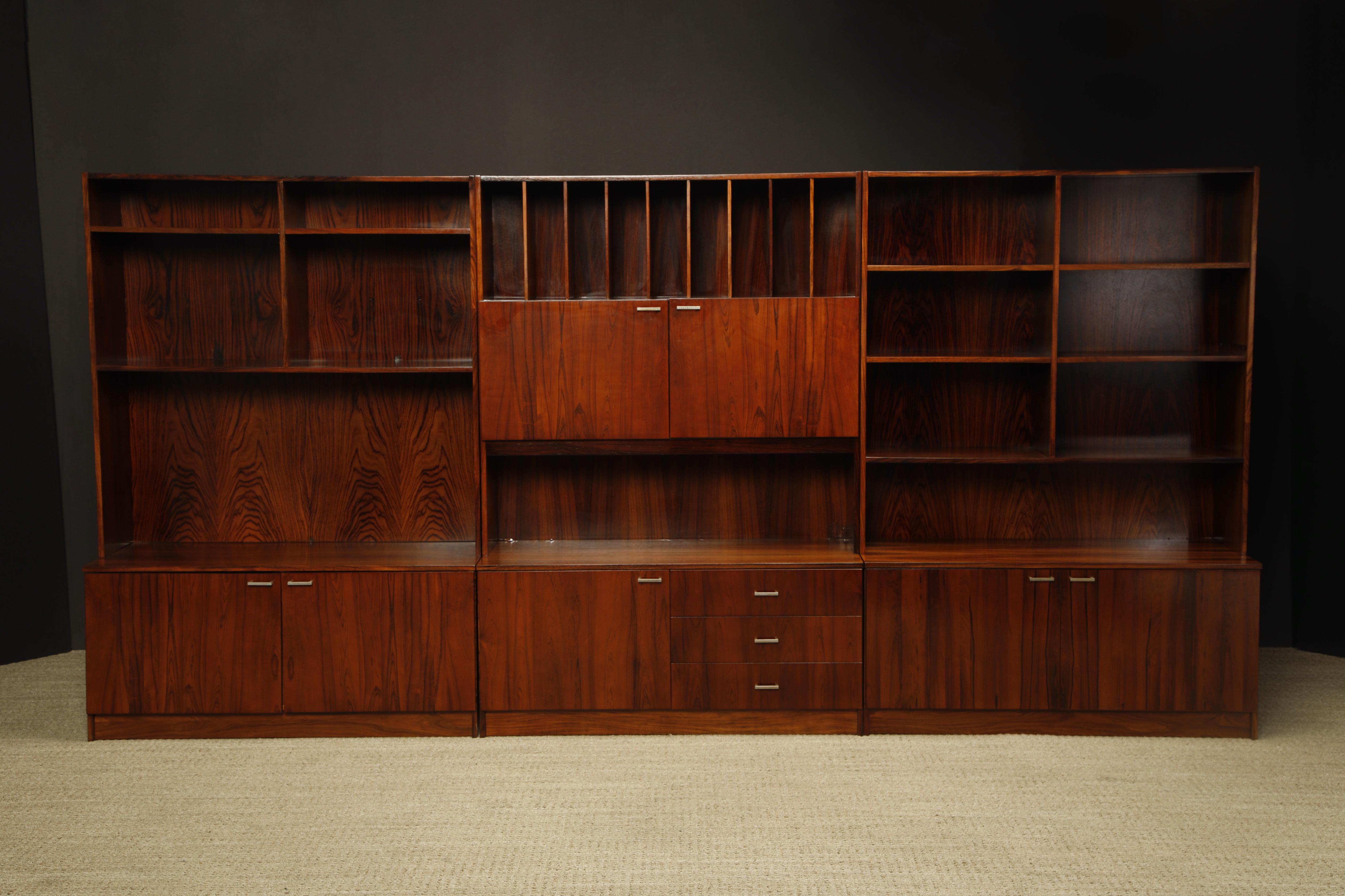 This incredible three section exotic Rosewood bookcase from circa 1970 was just refinished and ready to be placed into your home or office. A monumental 142
