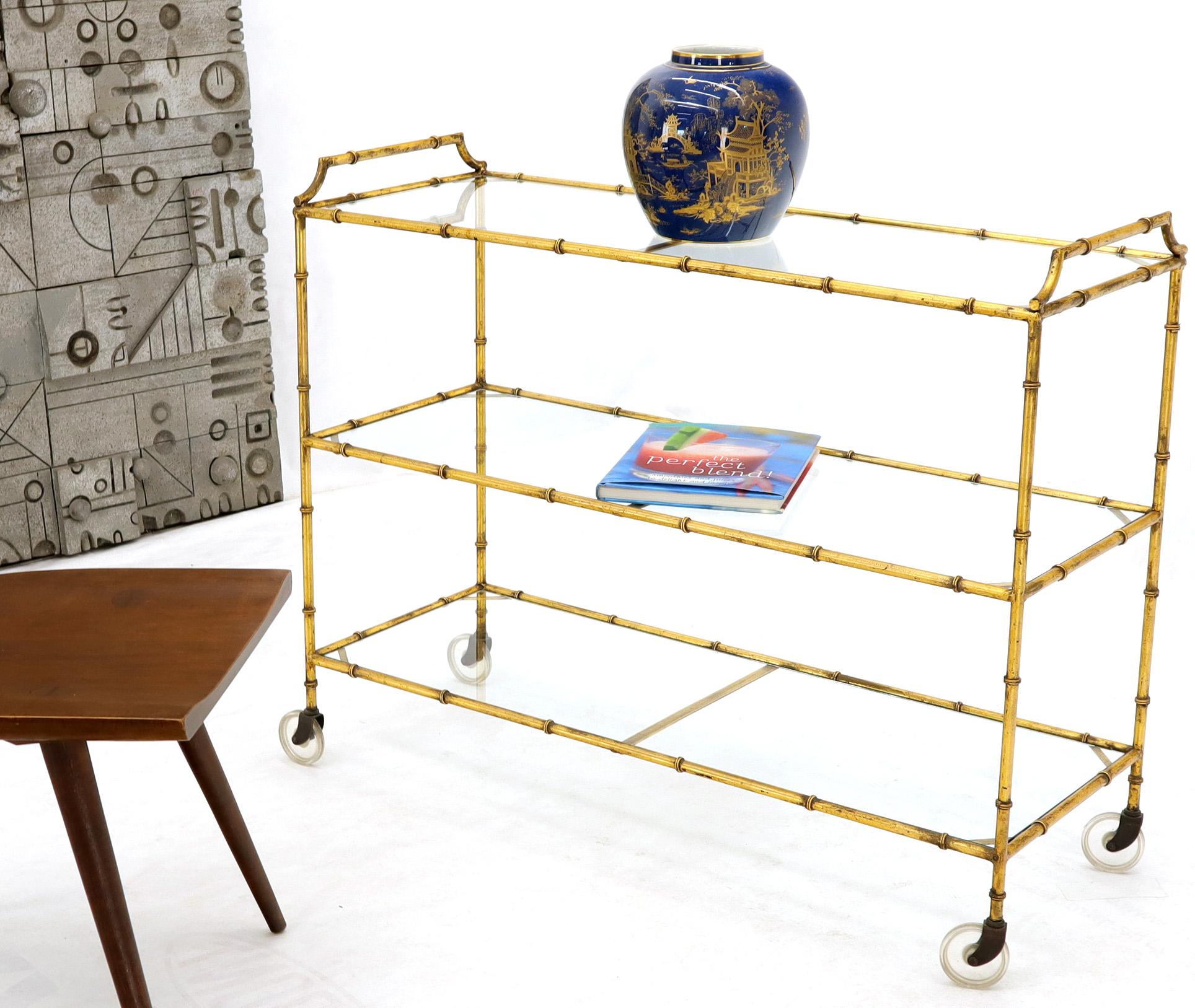 Mid-Century Modern long rectangle 3-tier gold gilt faux bamboo serving cart table with double handles.