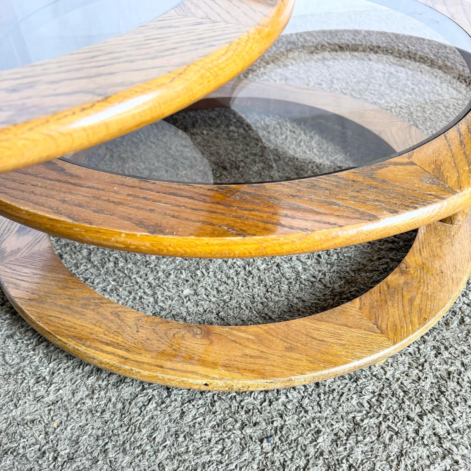 Mid Century Modern Three Tier Oak and Smoked Glass Swivel Coffee Table In Good Condition For Sale In Delray Beach, FL