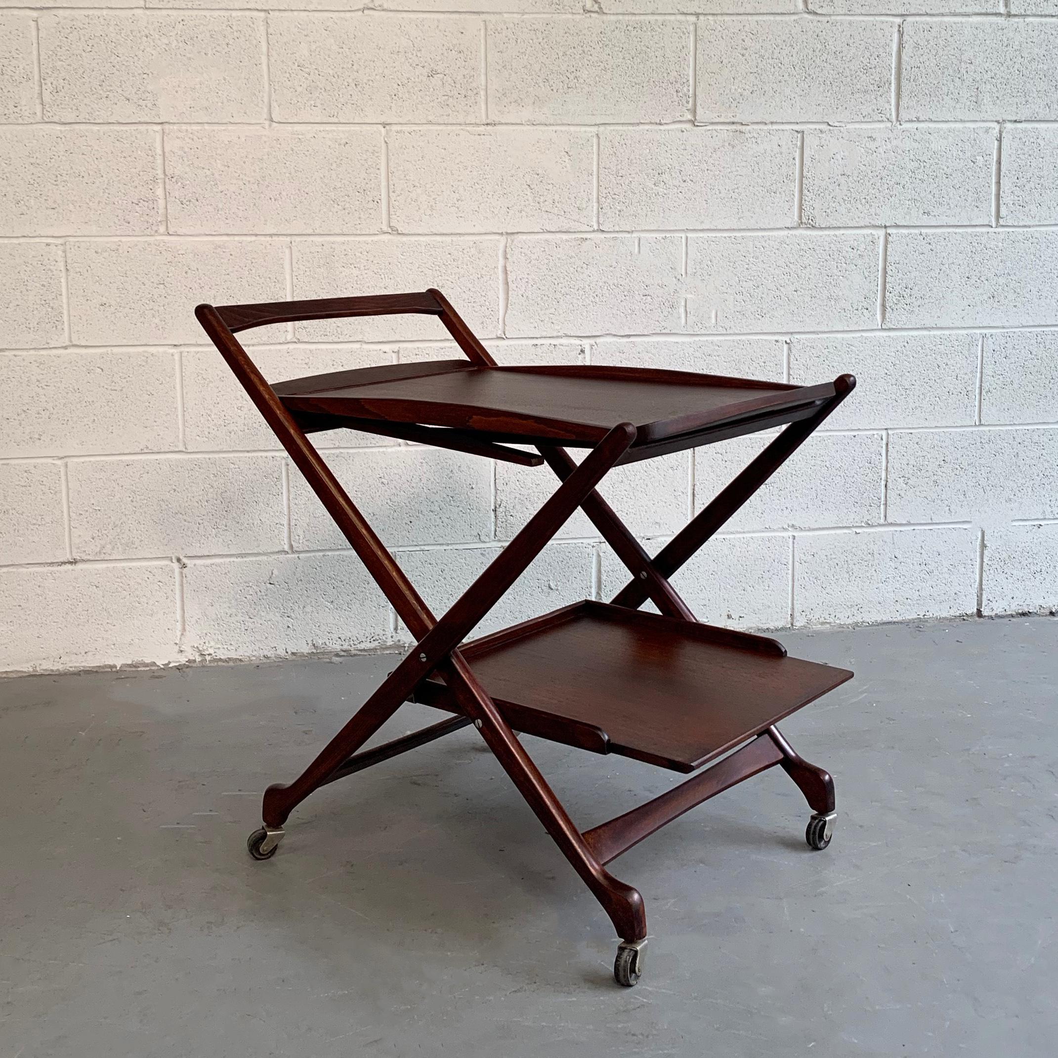 Mid-Century Modern, rolling, beechwood, serving / bar cart features 2 tiers at 26 inches height and 10 inches height with the top tier converting into an occasional table standing at 12 inches height.