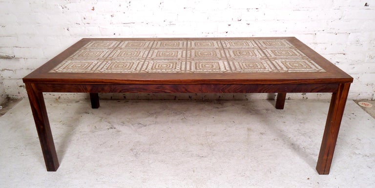 Gorgeous vintage modern tile top coffee table featured in rich rosewood grain.
(Please confirm item location - NY or NJ - with dealer).