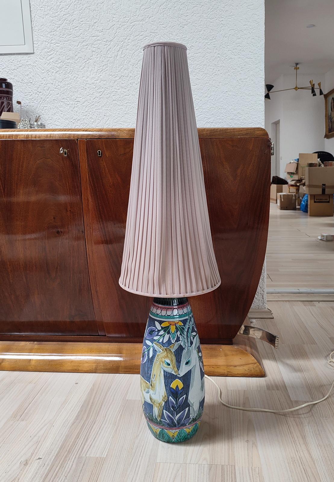Exceptional earthenware floor lamp made by Tilgmans Keramik, Sweden, early 1950s, design attributed to Marian Zawadzki. Large foot lamp richly decorated with a pair of deer to the front and leafage to the backside, realized in sgraffito technique.