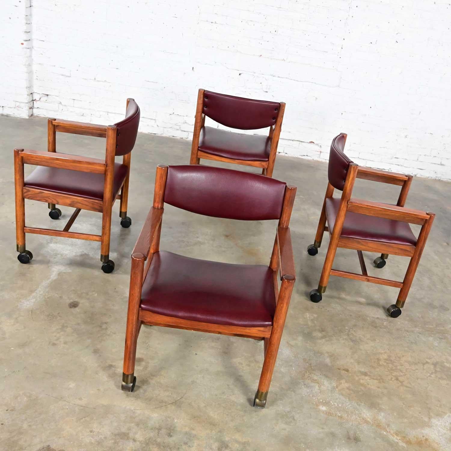 Mid-Century Modern to Modern Oak Maroon Vinyl Rolling Game or Dining Chairs For Sale 1