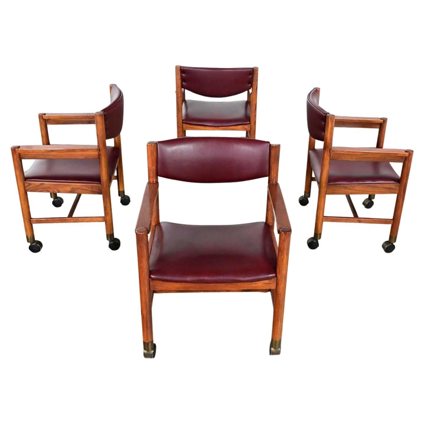 Mid-Century Modern to Modern Oak Maroon Vinyl Rolling Game or Dining Chairs For Sale