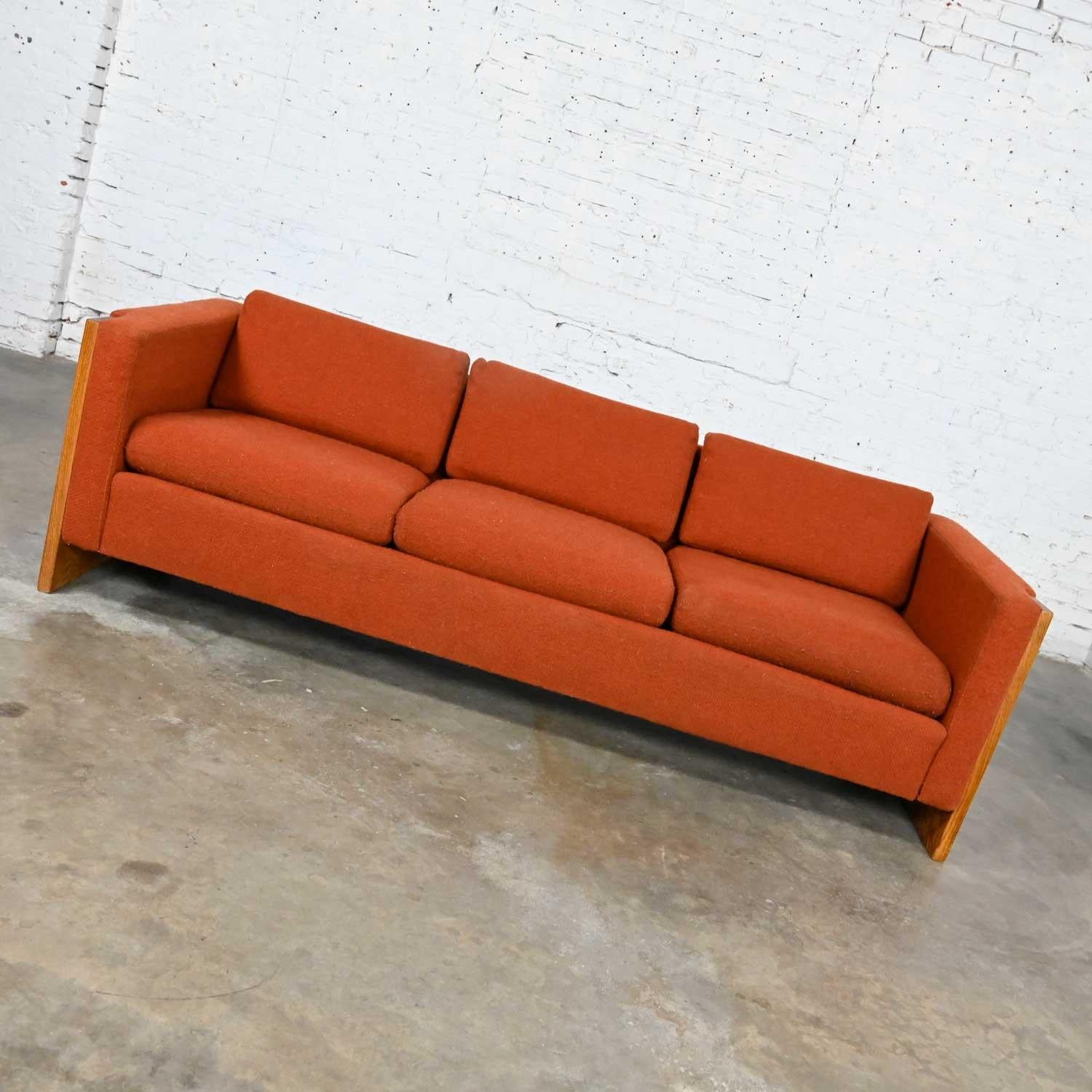 Fabulous Mid-Century Modern to modern tuxedo style sofa with oak frame and rust or burnt orange large-weave hopsacking fabric. Beautiful condition, keeping in mind that this is vintage and not new so will have signs of use and wear. There is a bit