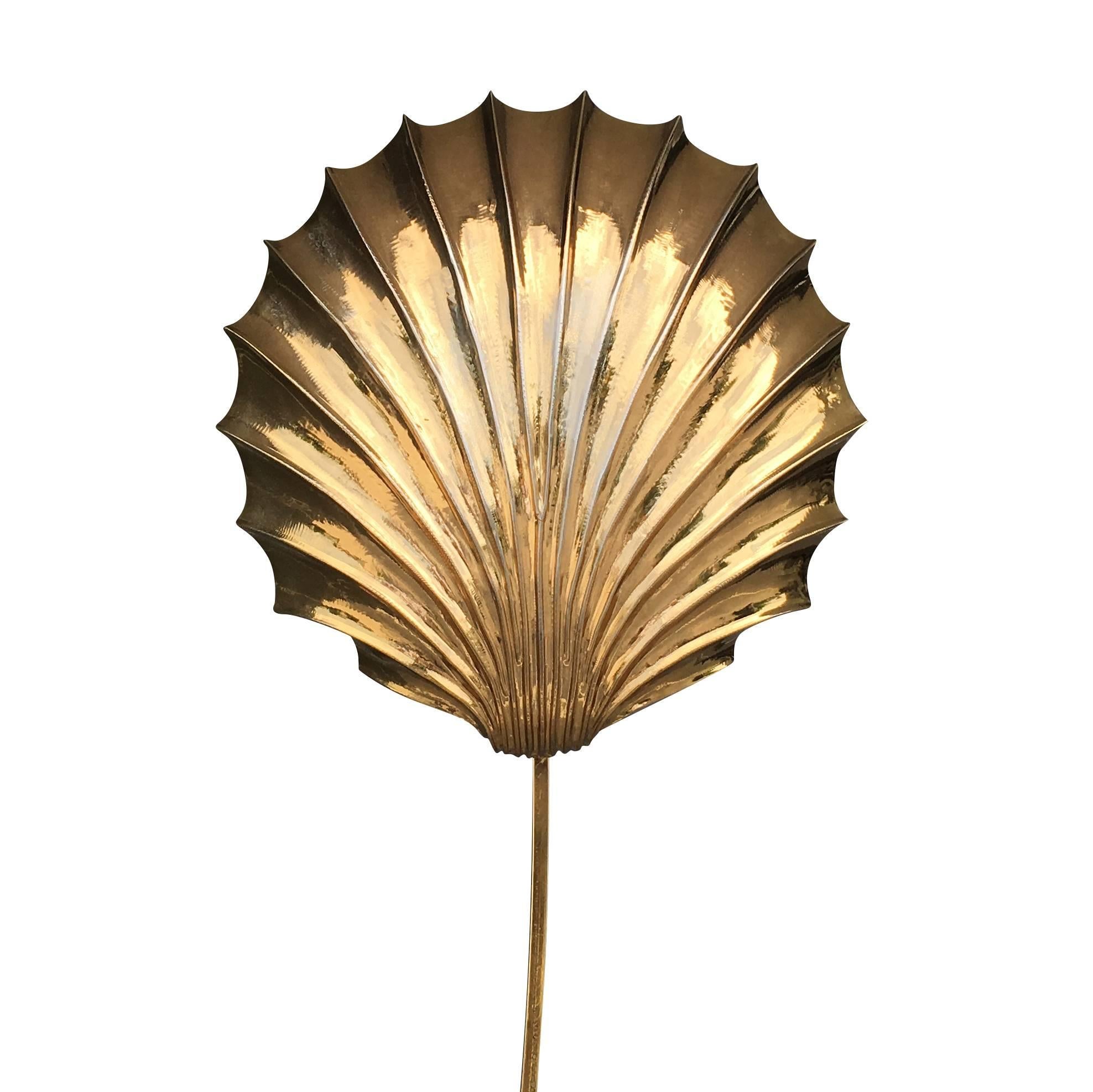 Italian designer Tommaso Barbi is best known for his whimsical furniture featuring organic forms, including brass leaf-shaped lamps like this one, circa 1970s hammered by hand in brass.