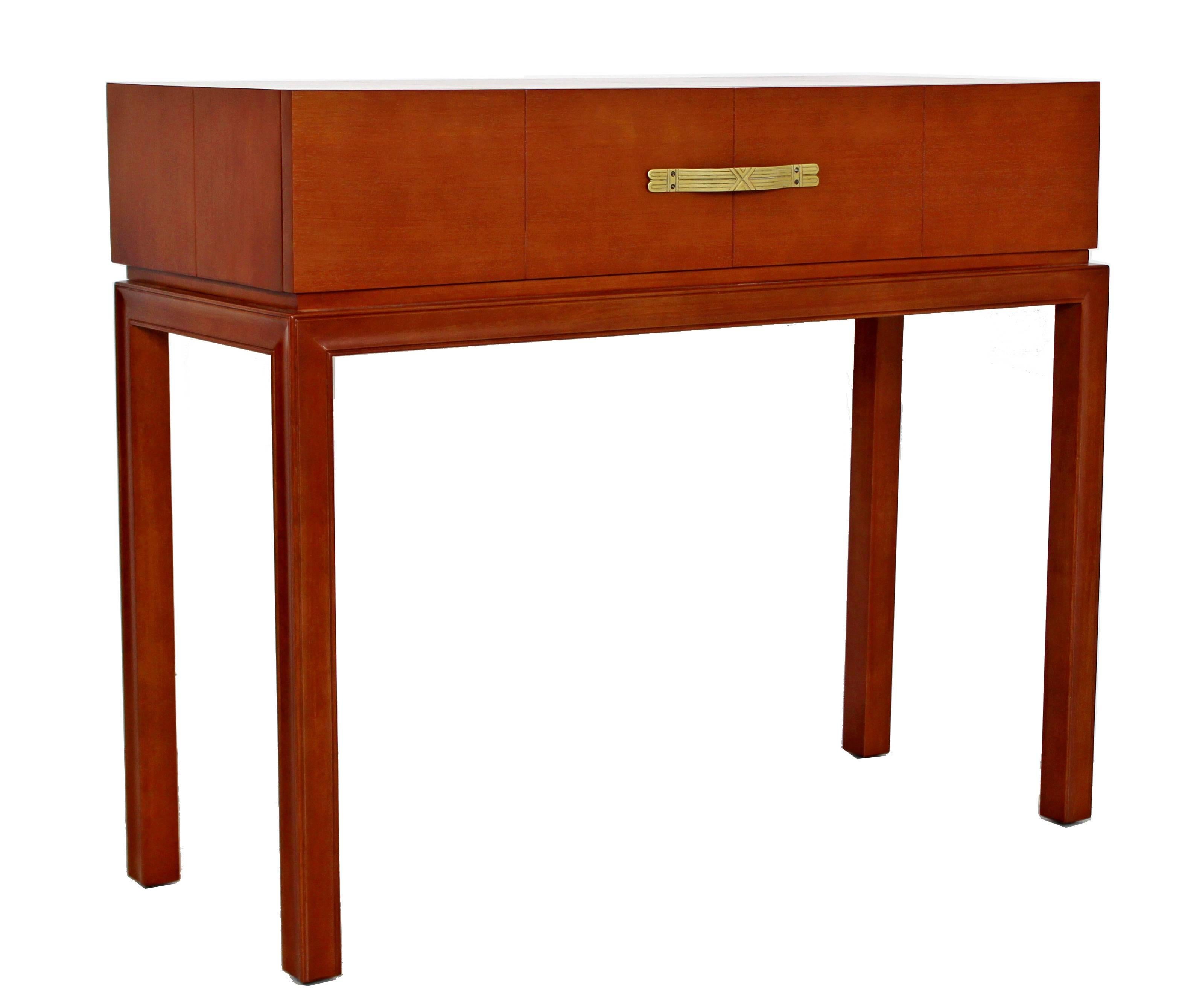 For your consideration is an absolutely stunning console table, with one drawer that has a bronze pull, by Tommi Parzinger for Charak Modern, circa 1950s. In excellent condition, just came back from being professionally refinished. The dimensions