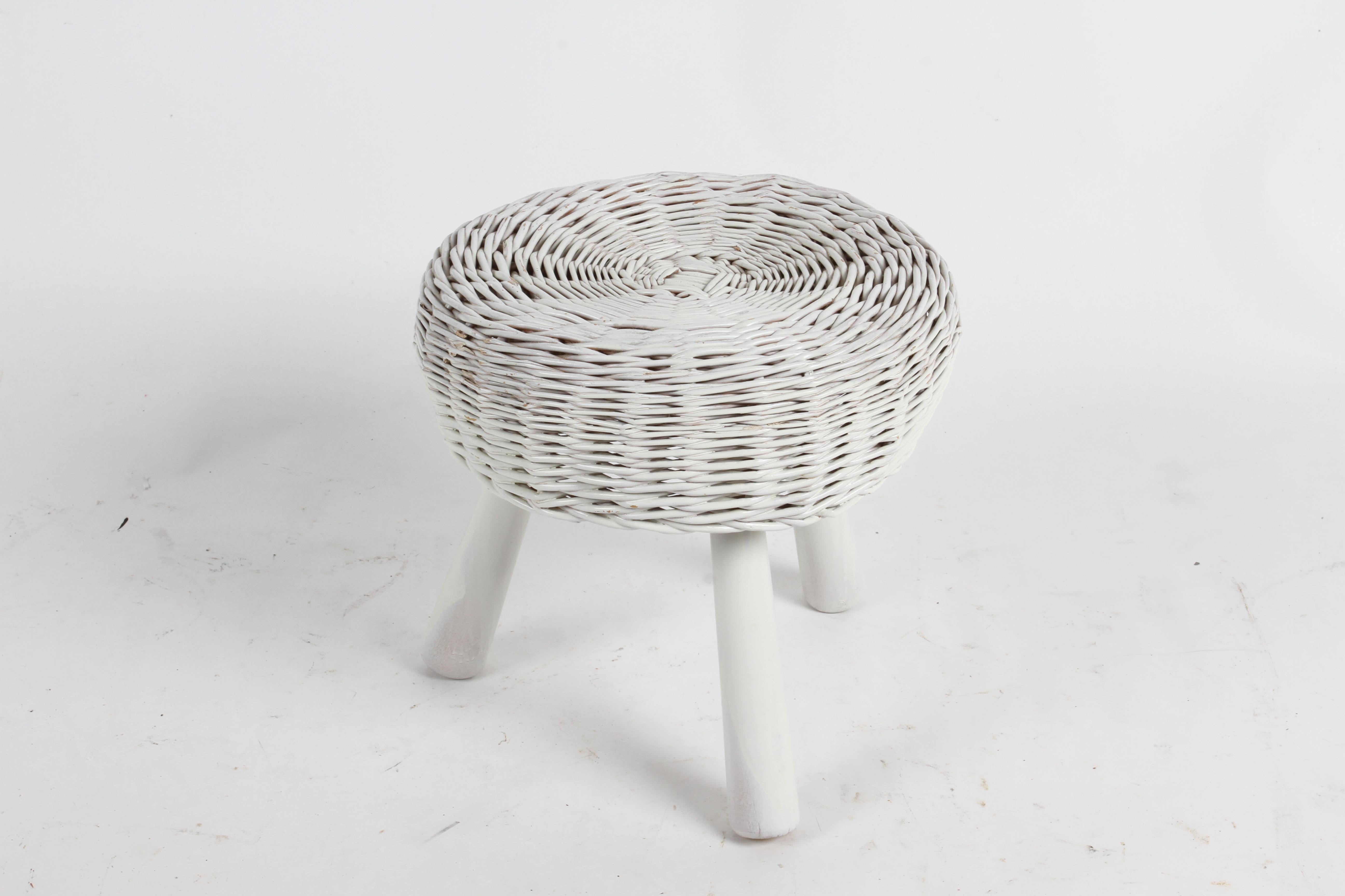 Mid-Century Modern Tony Paul round rattan or wicker stool on wood legs. Wicker has been spray painted at some point, some runs , wear to finish and minor loss to rattan. See Images.

