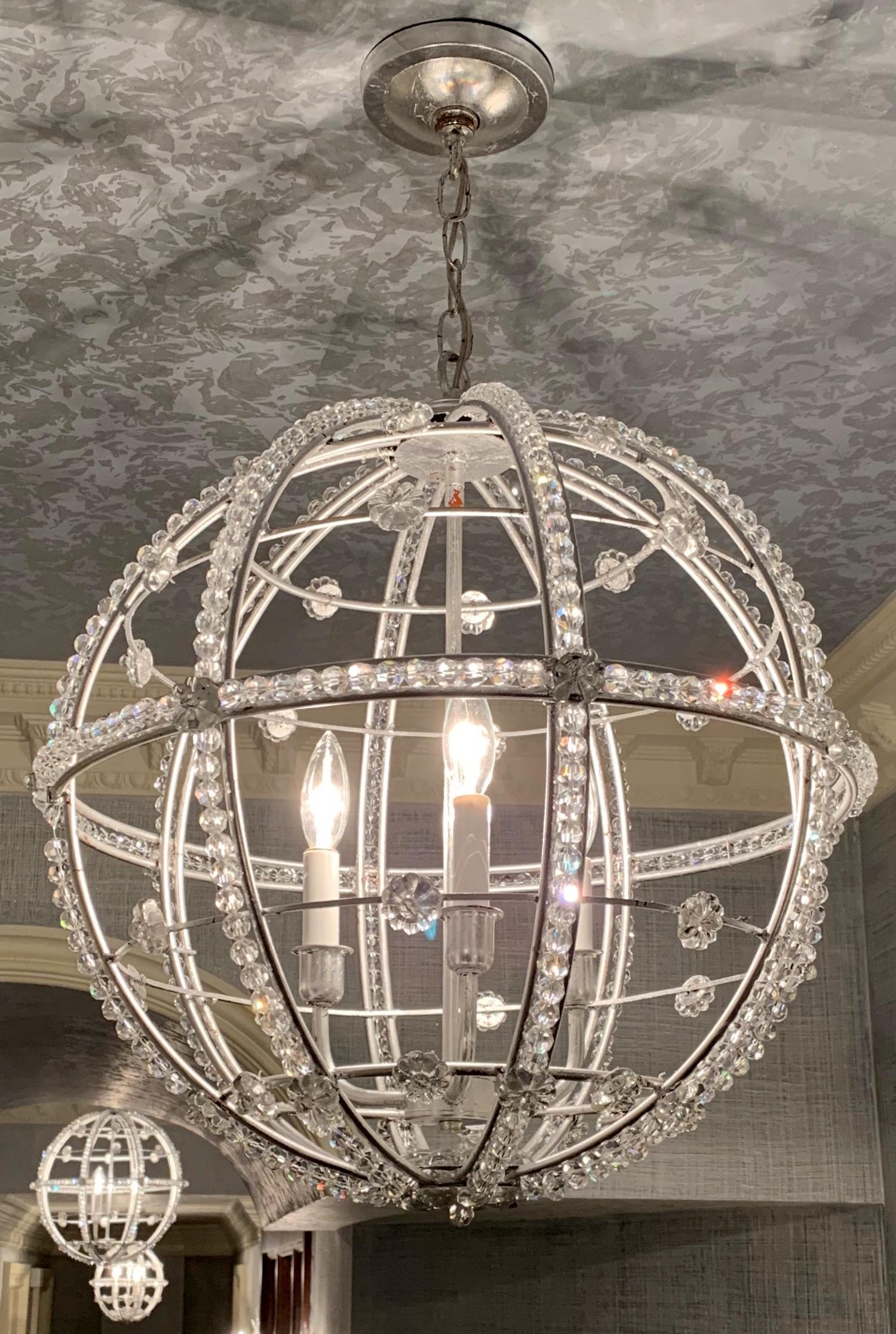 A wonderful Mid-Century Modern transitional silver leaf Sputnik ball chandelier light fixture
Perfect for any space, this silver leaf Sputnik style chandelier is detailed with crystal beads and accented with crystal flowers. 

Measures: 21