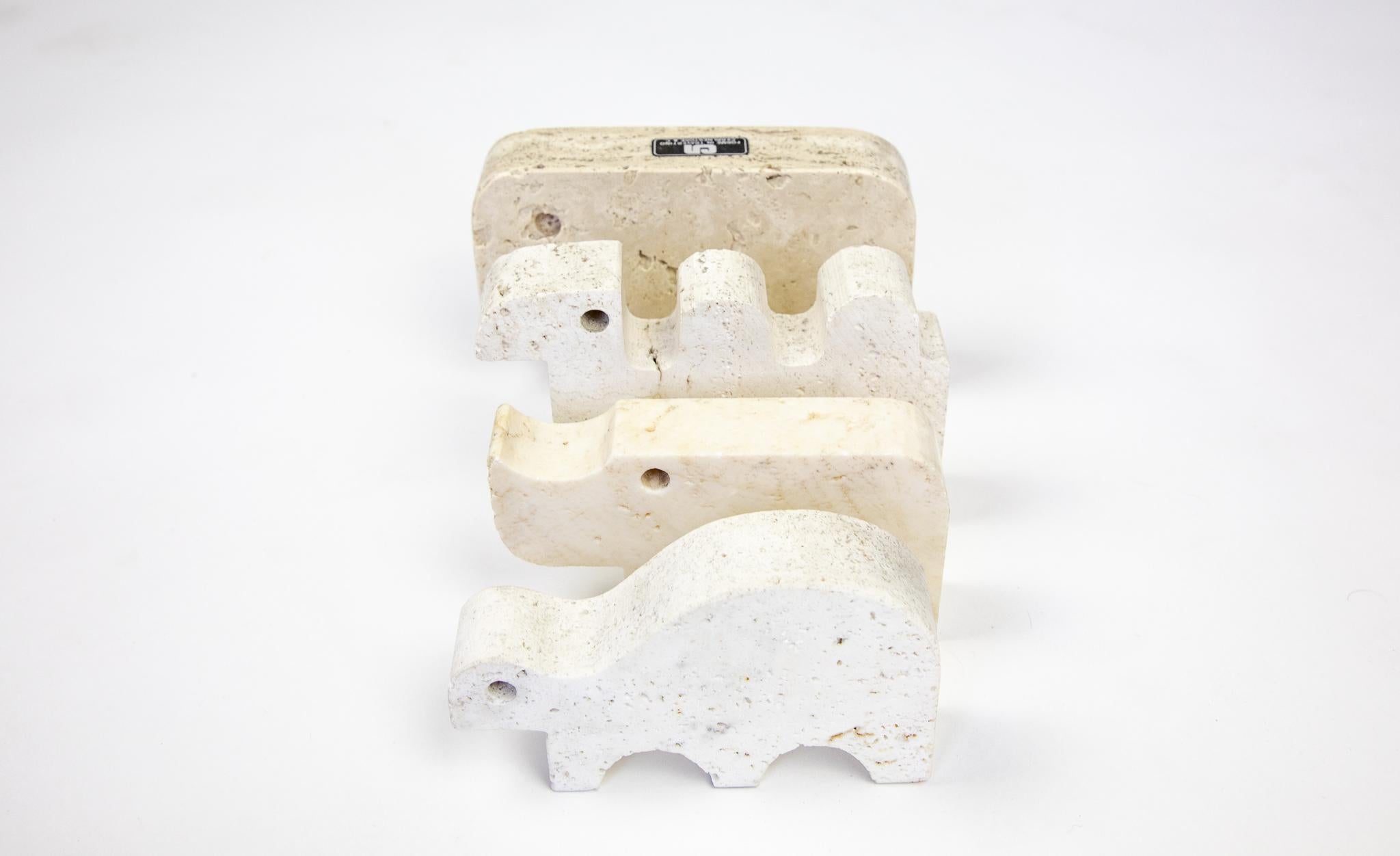 Mid-Century Moderntravertine animals sculptures in Brutalist style, Italy 1970s.

This lovely set of four travertine animal sculptures in brutalist style impresses with its minimalist form. Handmade from travertine stone in the 70s this set will