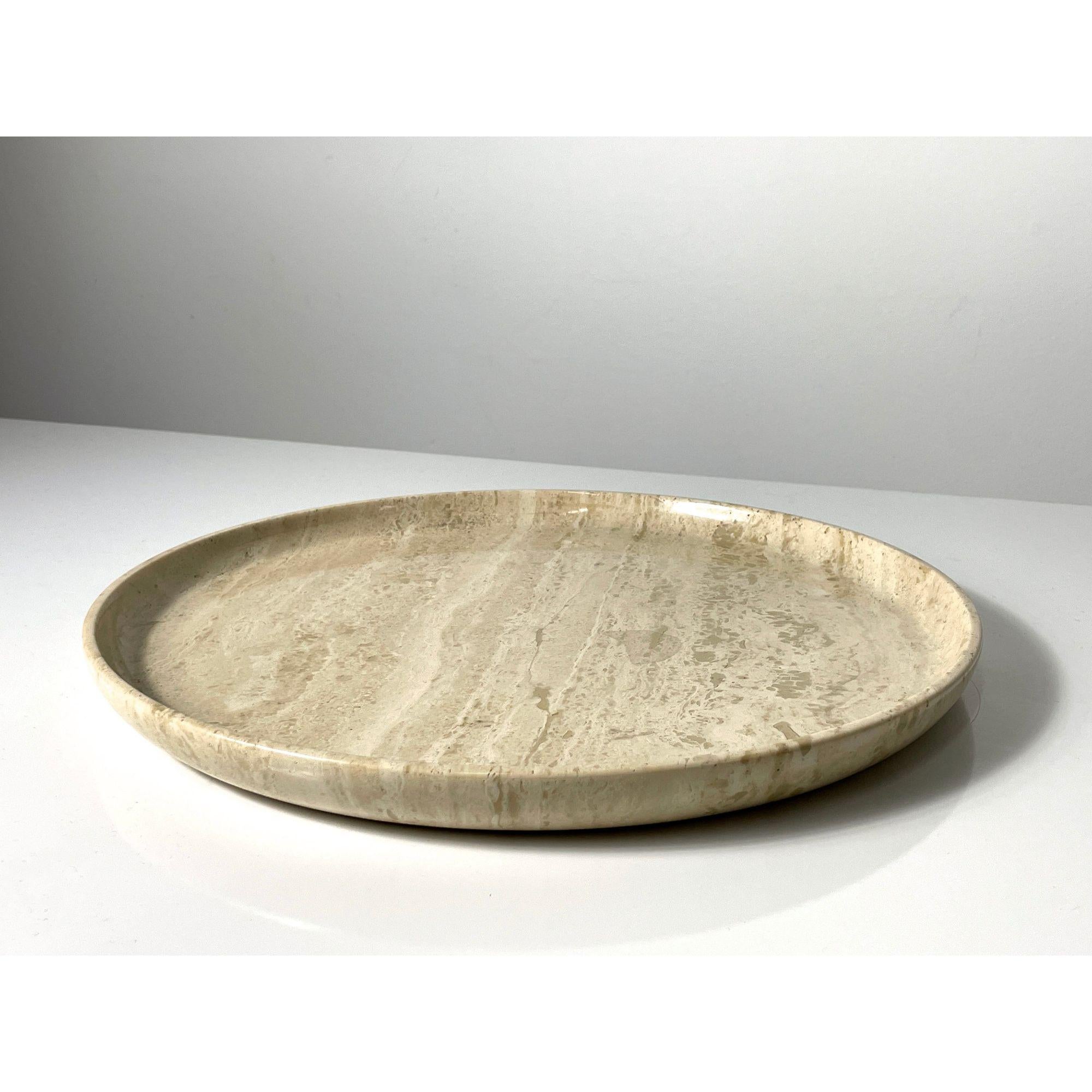 A polished travertine decorative tray / bowl attributed to Giusti and Di Rosa circa 1970s
Shallow form with lipped edge and green felted underside

Additional Information:
Materials: Travertine
Dimensions: 13.625