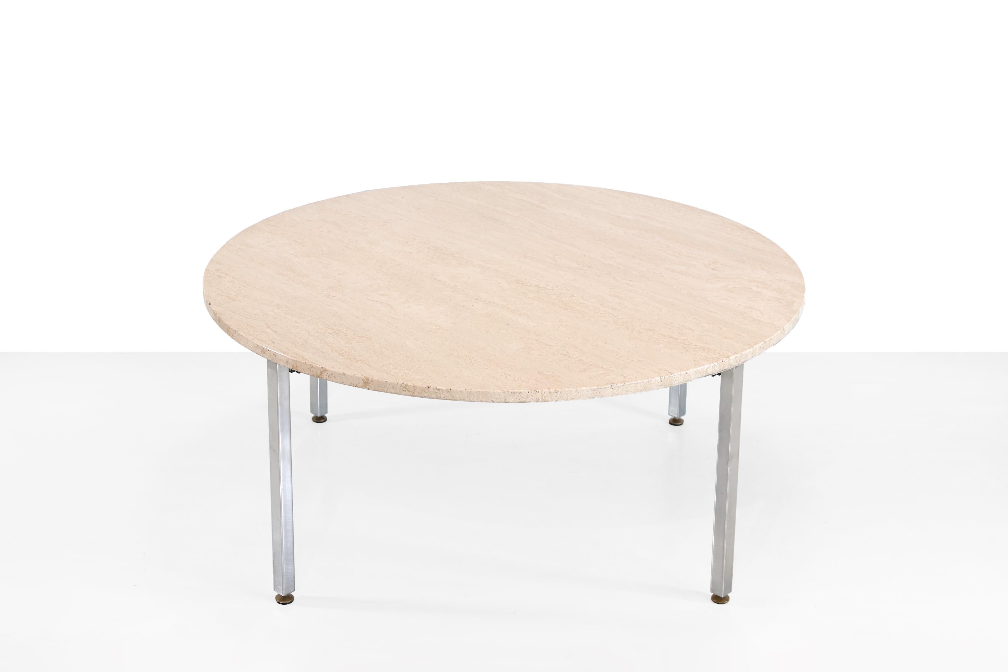 Beautiful round coffee table made of Italian Travertine. Beautiful round solid natural stone top on a chrome minimalist metal base. Measures: This table has a diameter of 100 cm and a height of 44 cm.