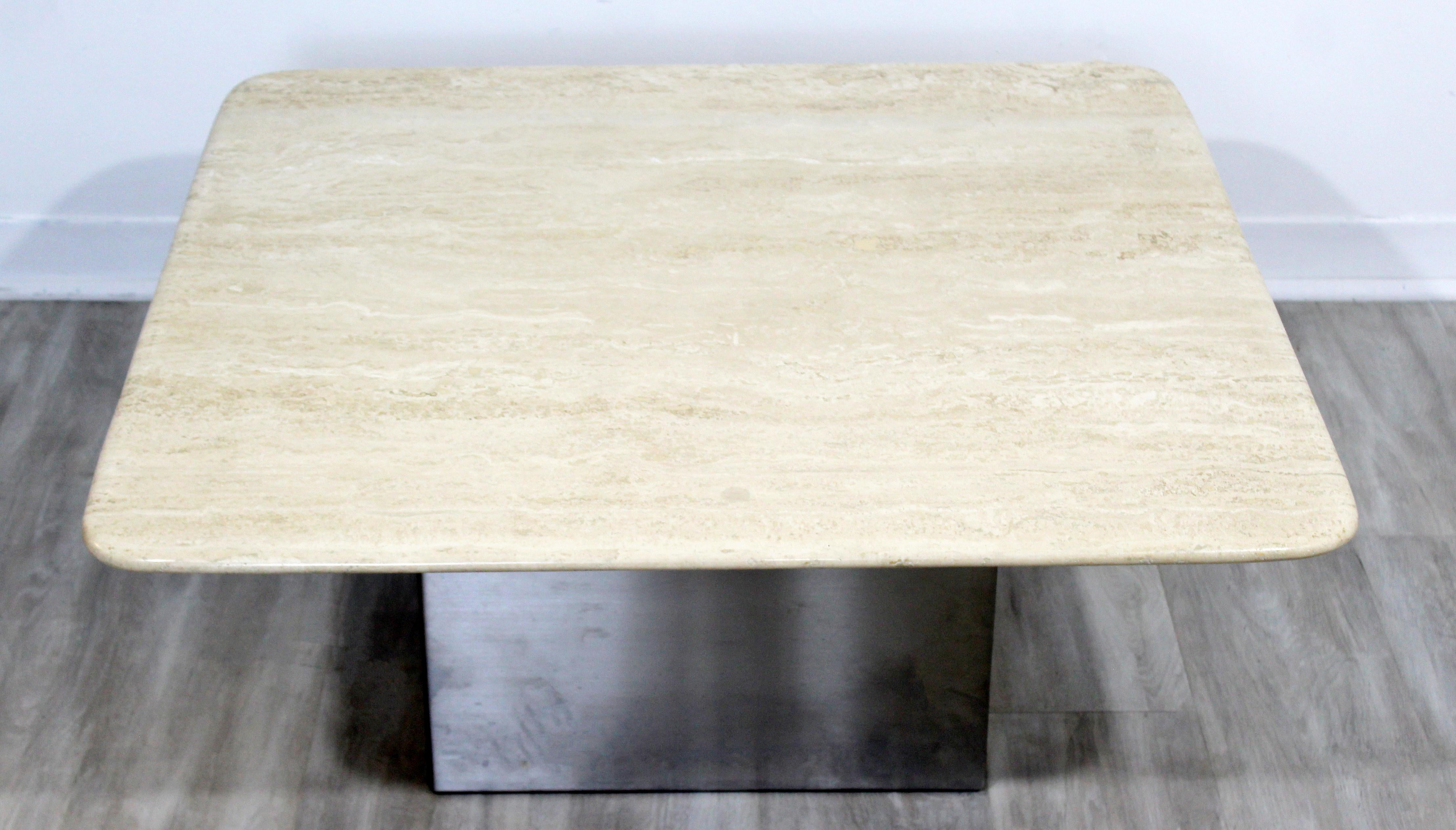For your consideration is a sensational, square travertine topped coffee table, with steel base, in the style of Milo Baughman, circa 1960s-1970s. In excellent vintage condition. The dimensions are 35.5