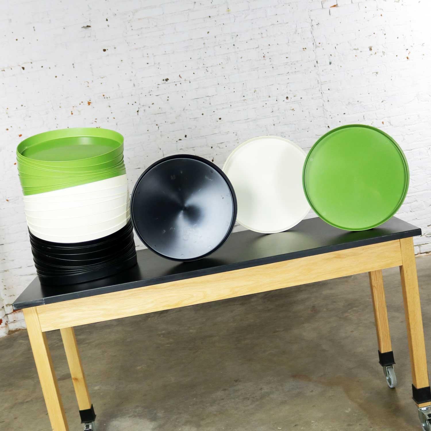 Incredible and fun Mid-Century Modern plastic trays in avocado green, black, and white. Called Splatter Platters and manufactured by Sabe’s of Fort Smith, Arkansas. They are in wonderful condition. Most have never been used. Some have minor scuffs