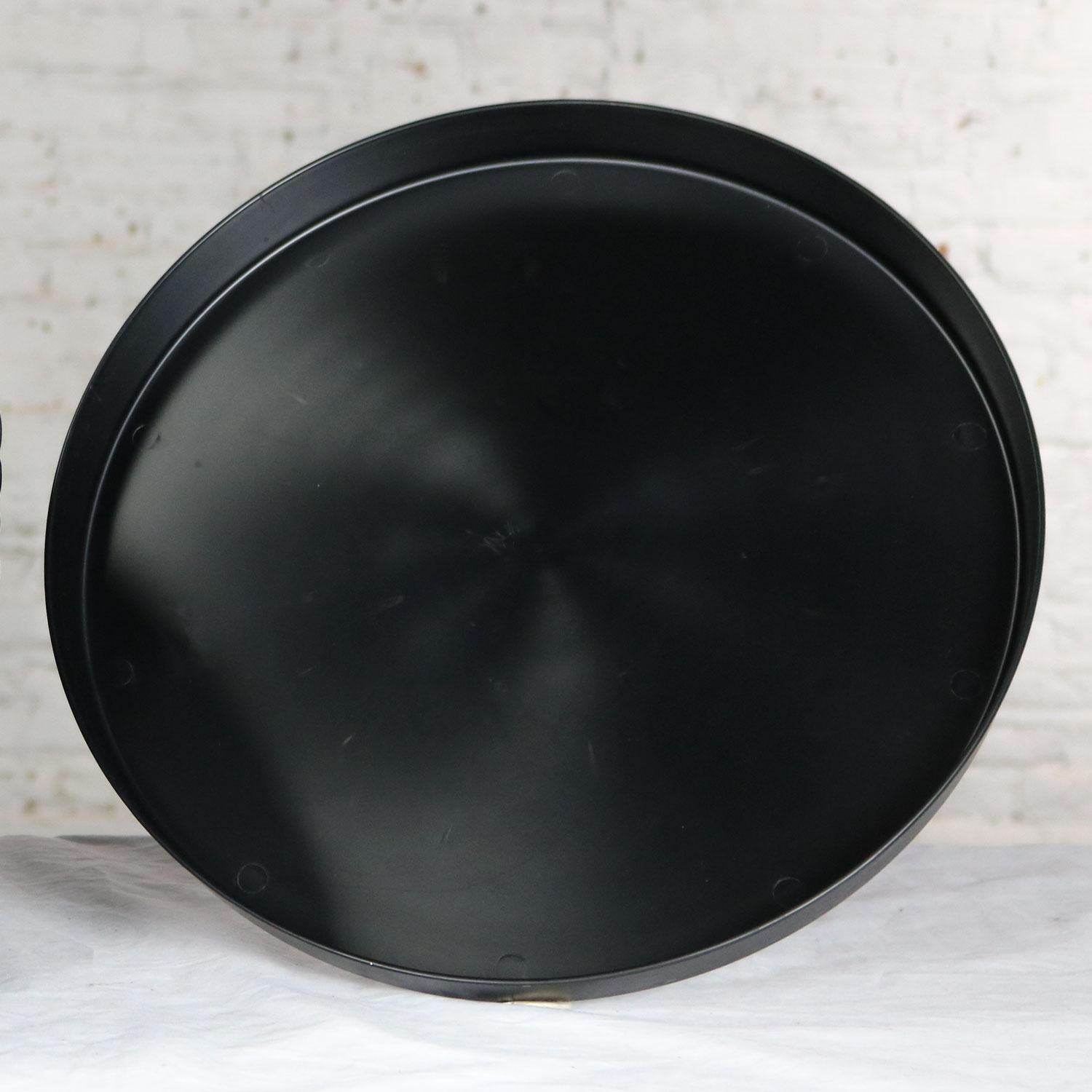 Incredible and fun Mid-Century Modern black plastic trays called Splatter Platters and manufactured by Sabe’s of Fort Smith, Arkansas. There are 12 and they are in wonderful condition. Most have never been used. Some have minor scuffs and scratches.