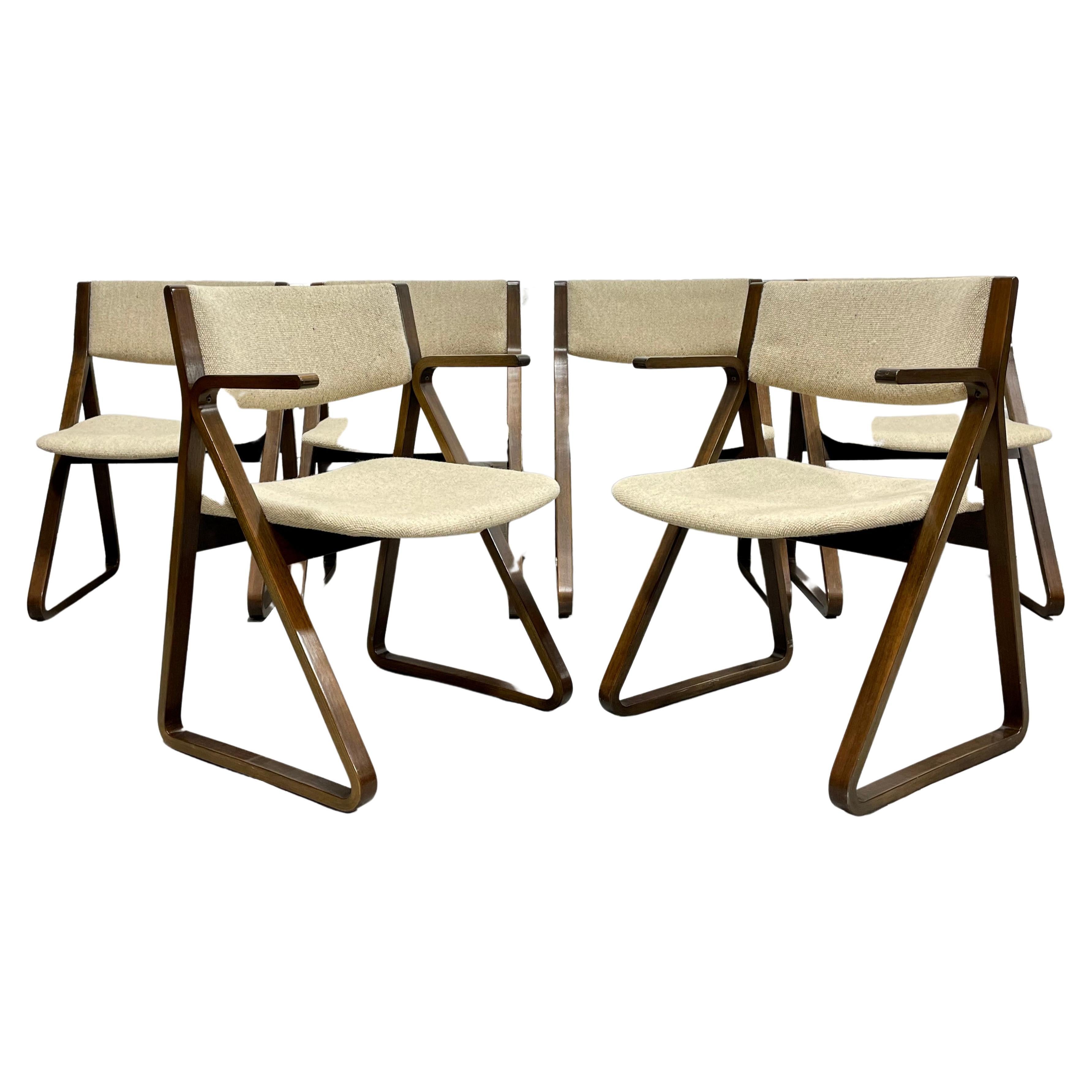 Rare Mid-Century Modern “Triangle” Dining Chairs designed by Robert DeFuccio for Stow Davis, set of six. The triangular profile of the chairs is incredible and the oatmeal colored upholstery contrasts beautifully with the darker walnut frames.