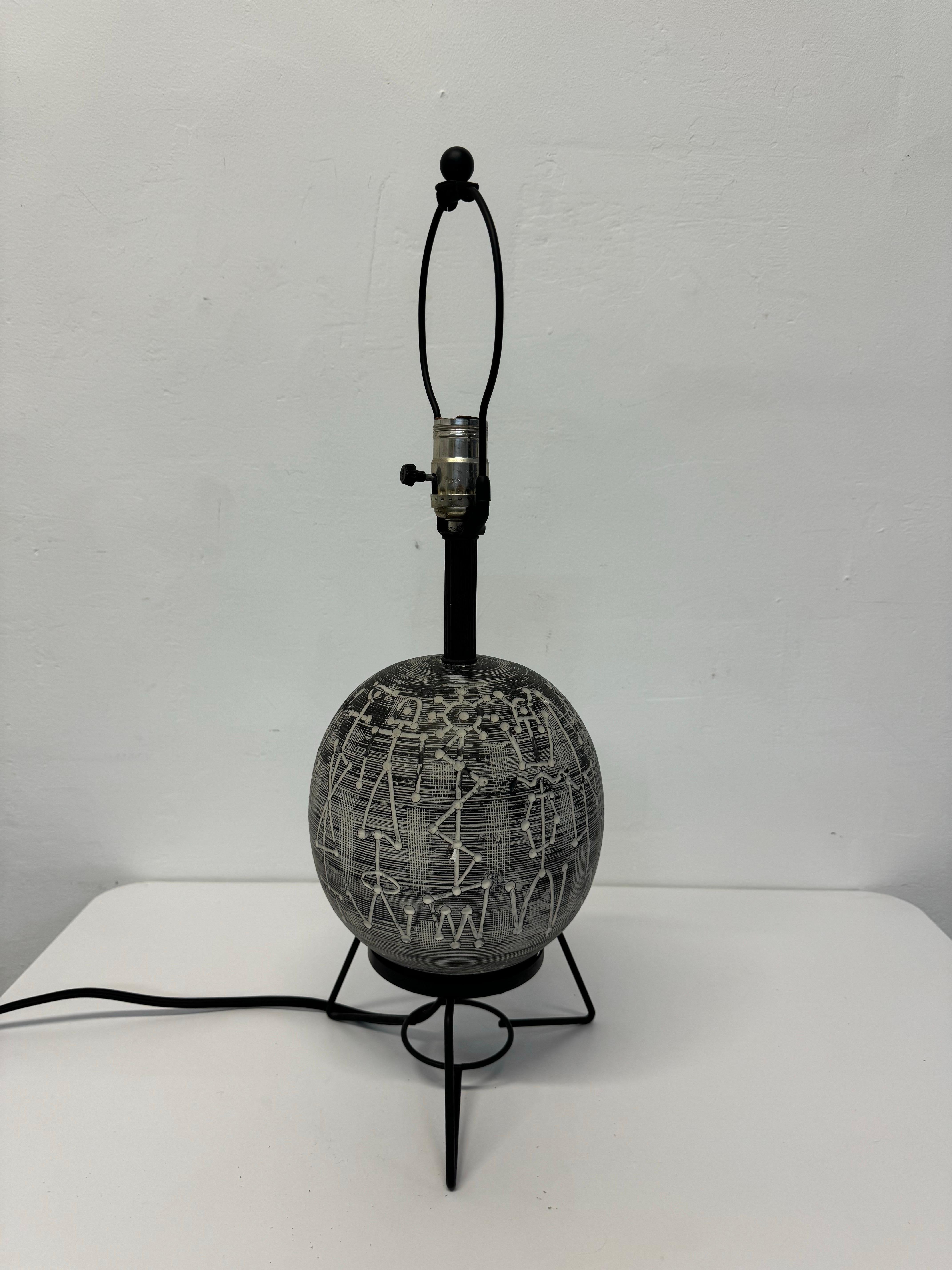 Mid-Century modern table lamp with black and white tribal motif, signed FAIP circa 1960s.  Does not include a shade.