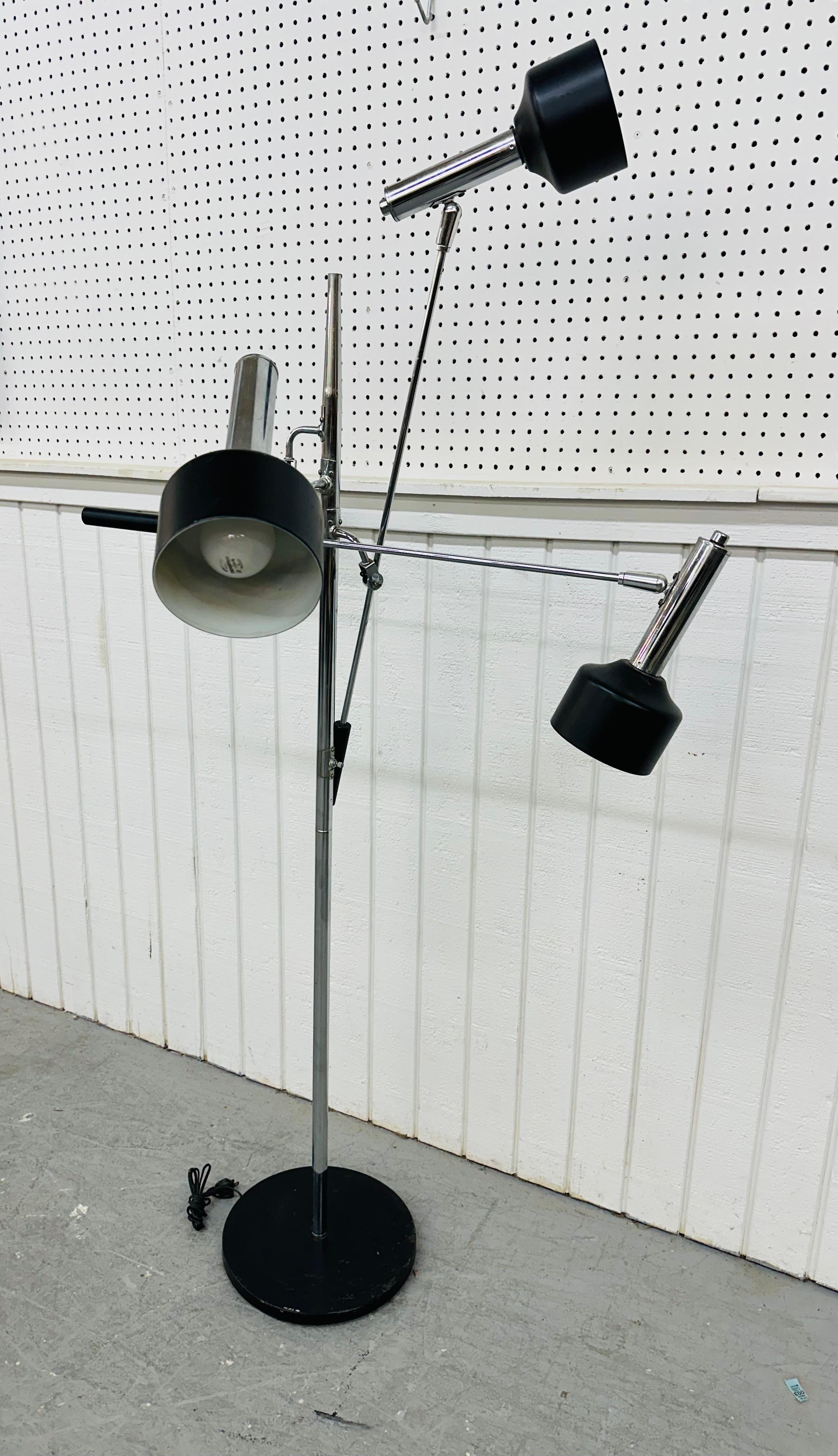 This listing is for a Mid-Century Modern Triennale Chrome Floor Lamp. Featuring an adjustable three arm design, chrome body, and round metal base. This is an exceptional combination of quality and design by Robert Sonneman.