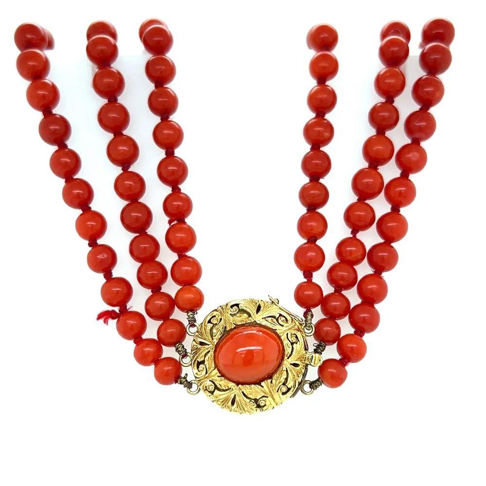  Simply Beautiful! Red Coral Multi 3 Strand Necklace, each bead measuring approx. 5.5mm-13.50mm, held by a Beautifully crafted 18K Yellow Gold clasp inset with an oval Red Coral. Necklace Hand strung with matching Silk cord. The necklace measures