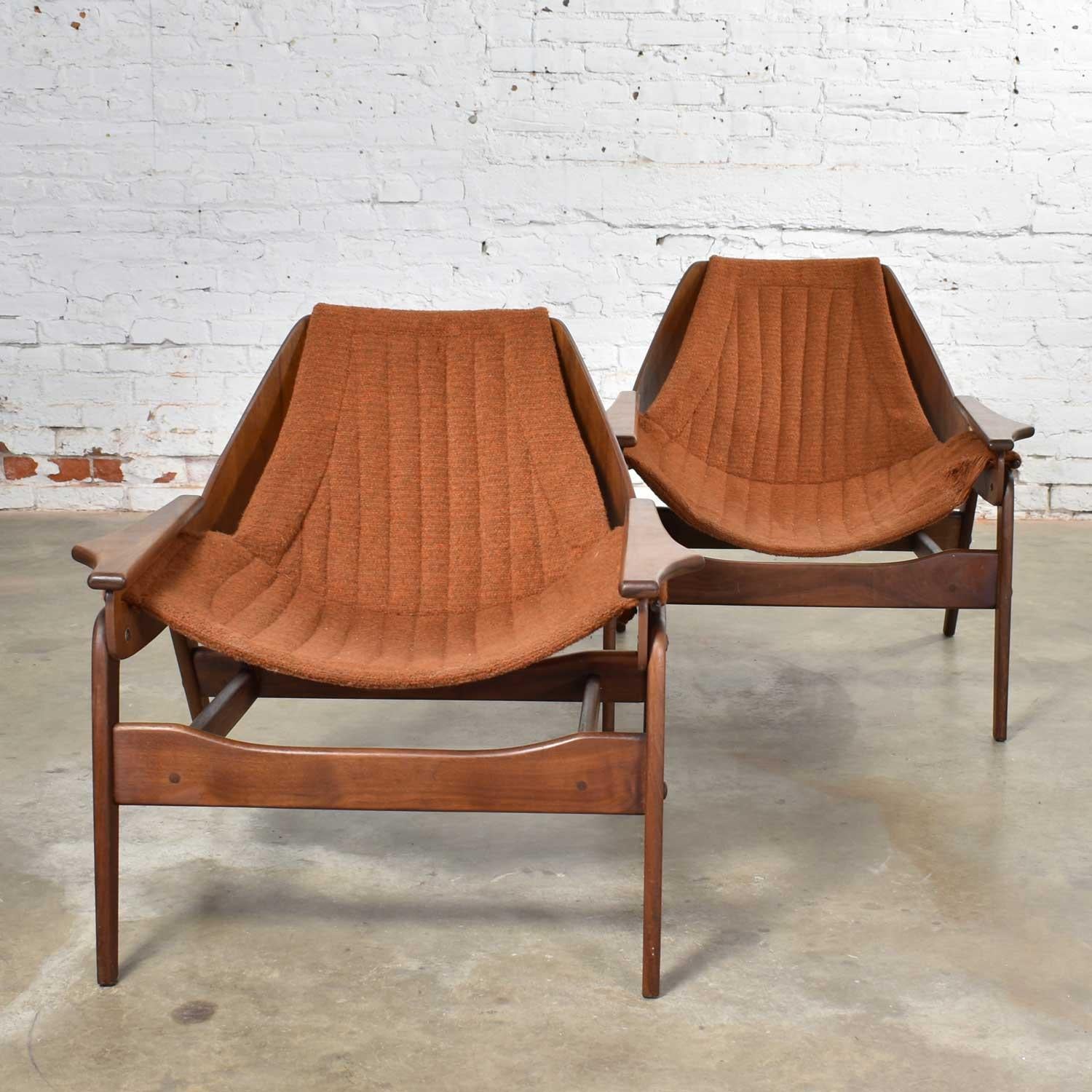 Handsome pair of Mid-Century Modern Triumph I sling chairs designed by Jerry Johnson for Charlton. They are in good vintage condition. The frames are in fabulous condition, but the slings will need to be remade. Please see photos, circa