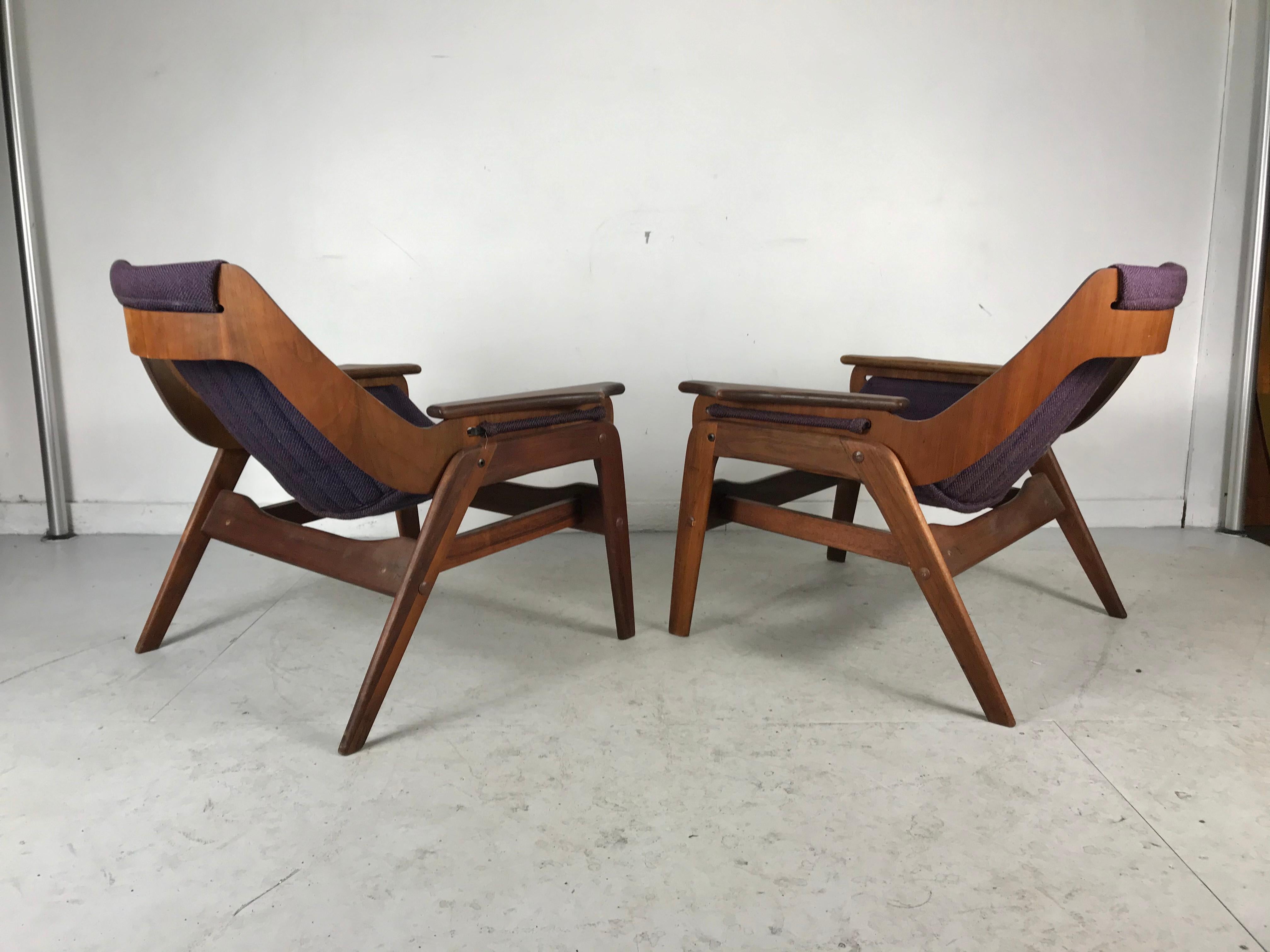 Classic dramatic pair of sculptural Modernist sling chairs designed by Jerry Johnson for Charlton. Trimph 1.... Nice vintage condition., retain original slings. Minor tearing to fronts, age appropriate wear. In-house restoration avail. Inquire?