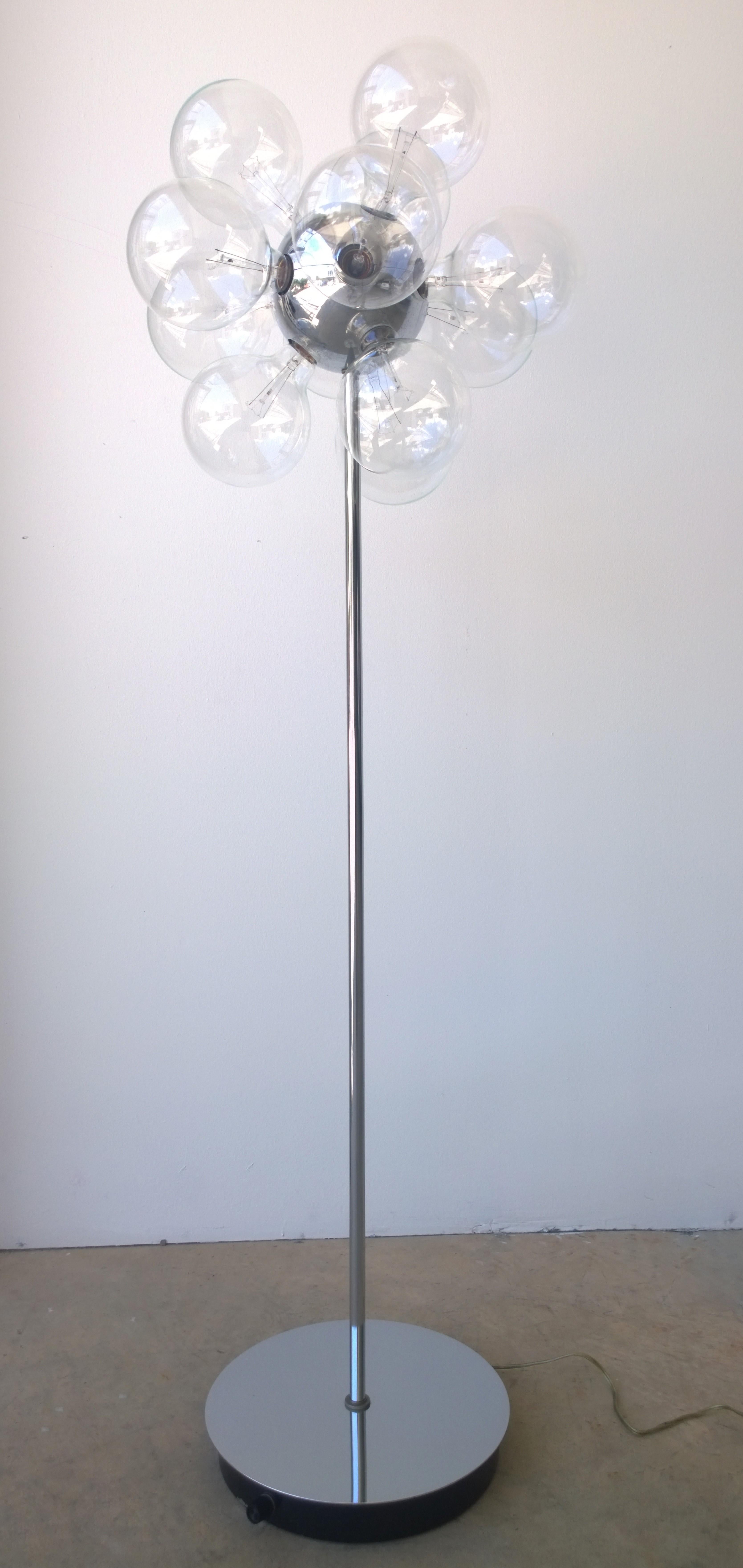 Offered is a signed Mid-Century Modern Sputnik floor lamp of chrome-plated steel with ten sockets that fit decorative 5