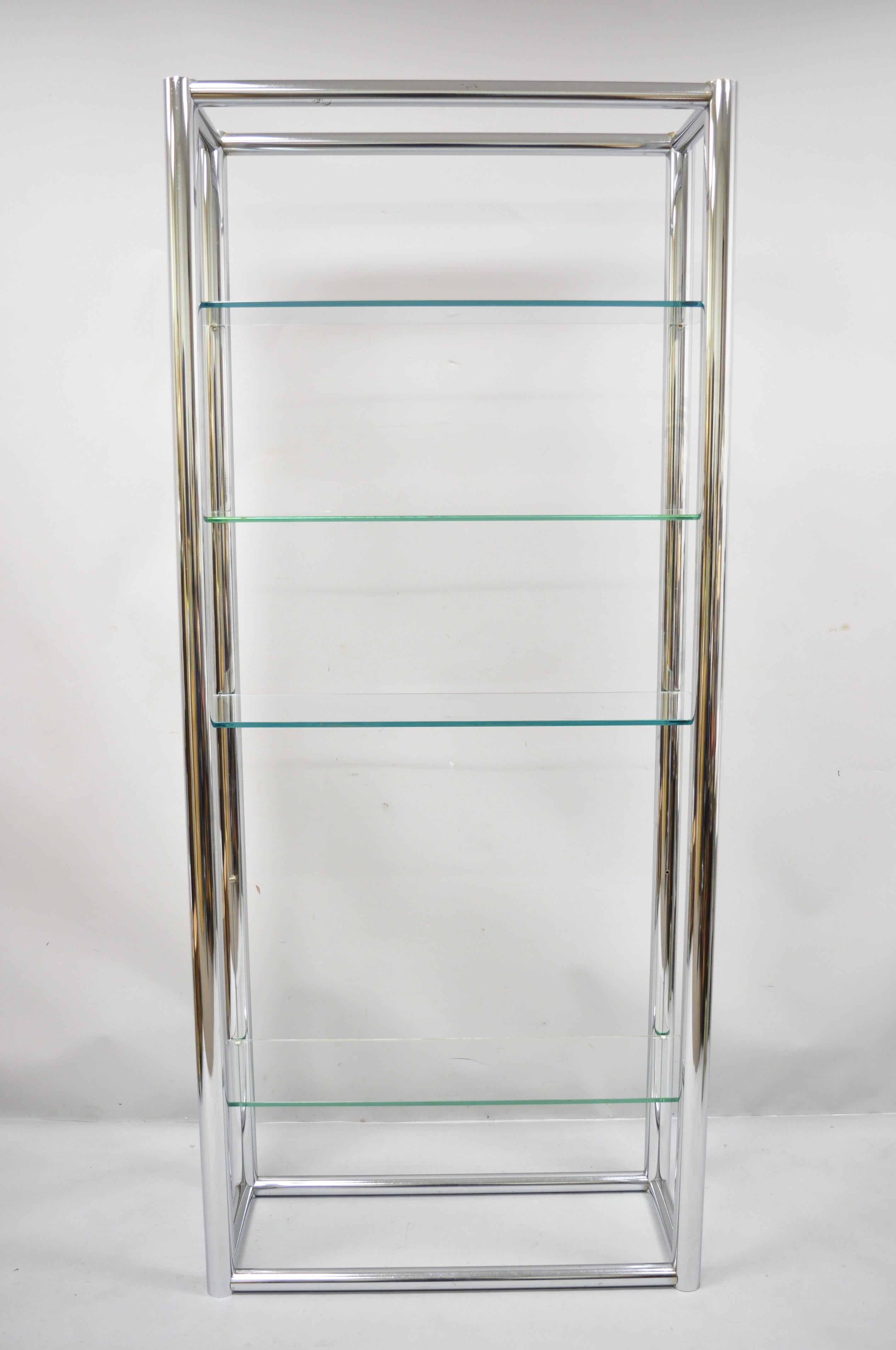 Mid-Century Modern tubular chrome metal étagère bookcase glass shelf Baughman style. Item features tubular chrome metal frame, 4 glass shelves, very nice vintage item, great style and form, Circa 1970s. Measurements: 78