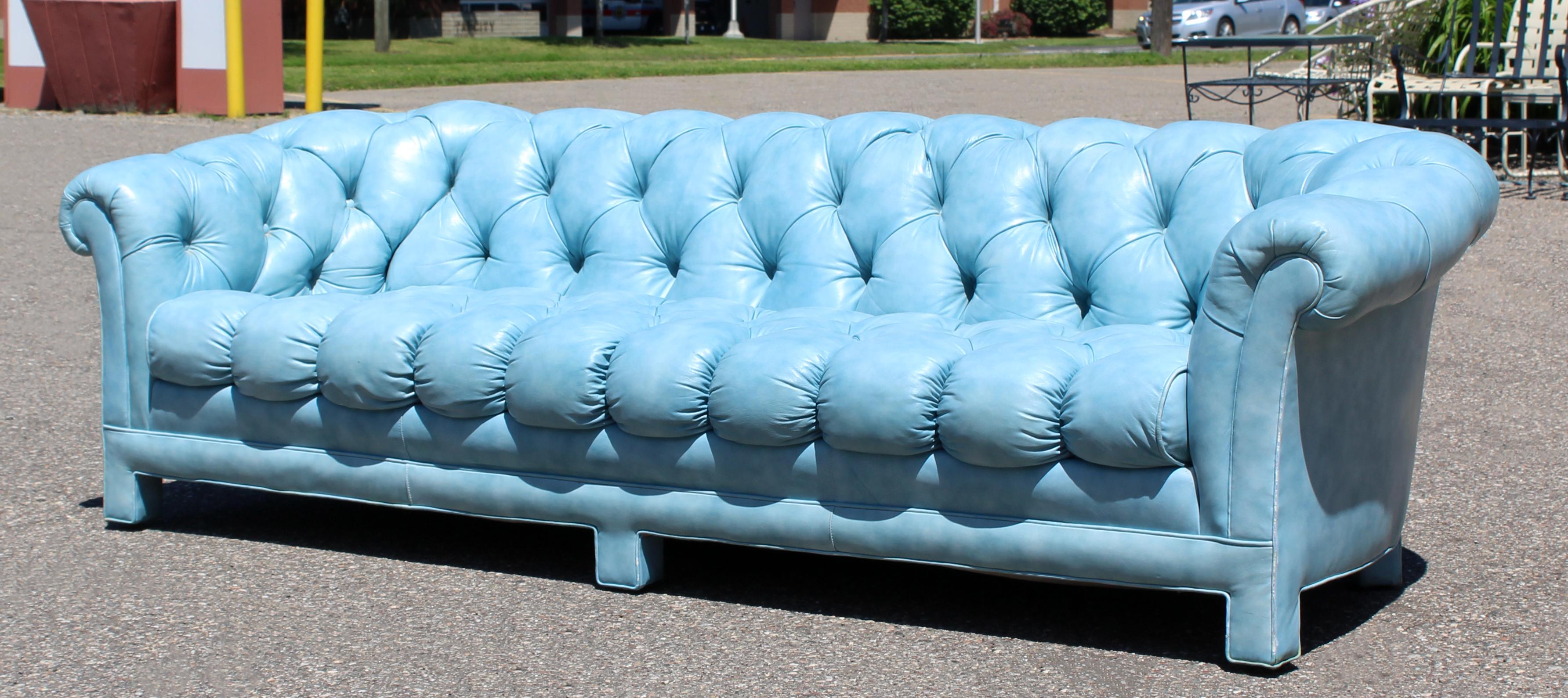 blue leather tufted sofa