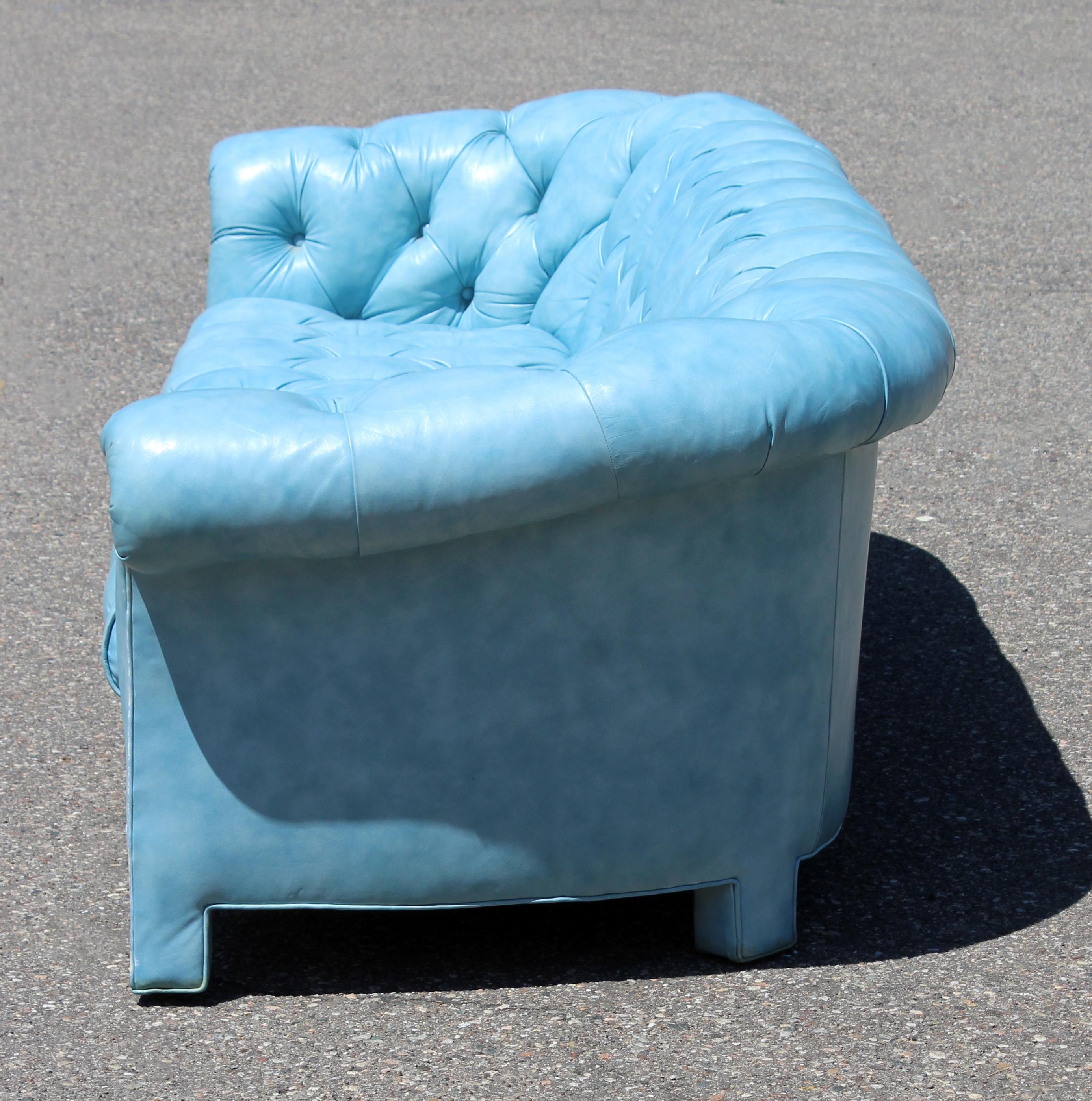 blue tufted leather sofa