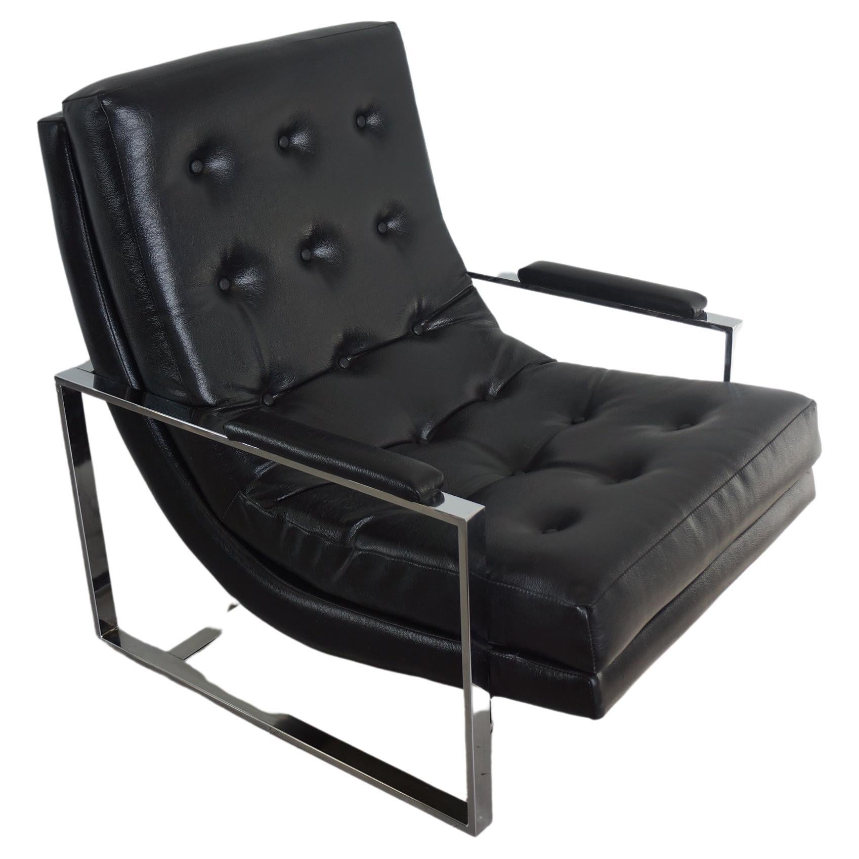 Spectacular mid century modern lounge chair in tufted leather and chrome. This incredibly comfortable lounge chair features a chrome body with a tufted leather seating. In the style of  William Katavalos, Ross Littell, and Douglas Kelly. 
In overall