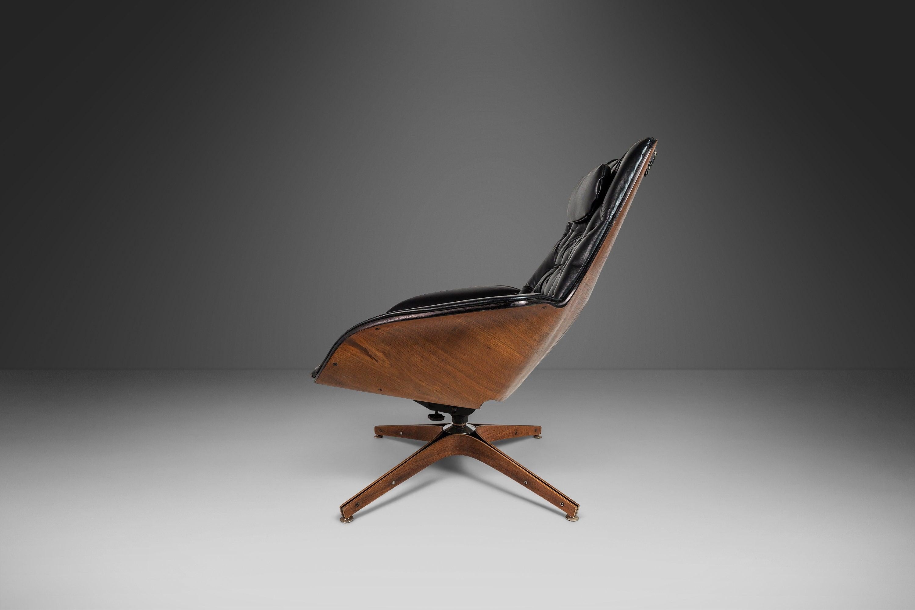 As comfortable as it iconic this lounge chair and ottoman set, designed by the acclaimed George Mulhauser, is the epitome of functional art. Constructed of walnut plywood audaciously shaped and featuring stunning natural woodgrains this chair and