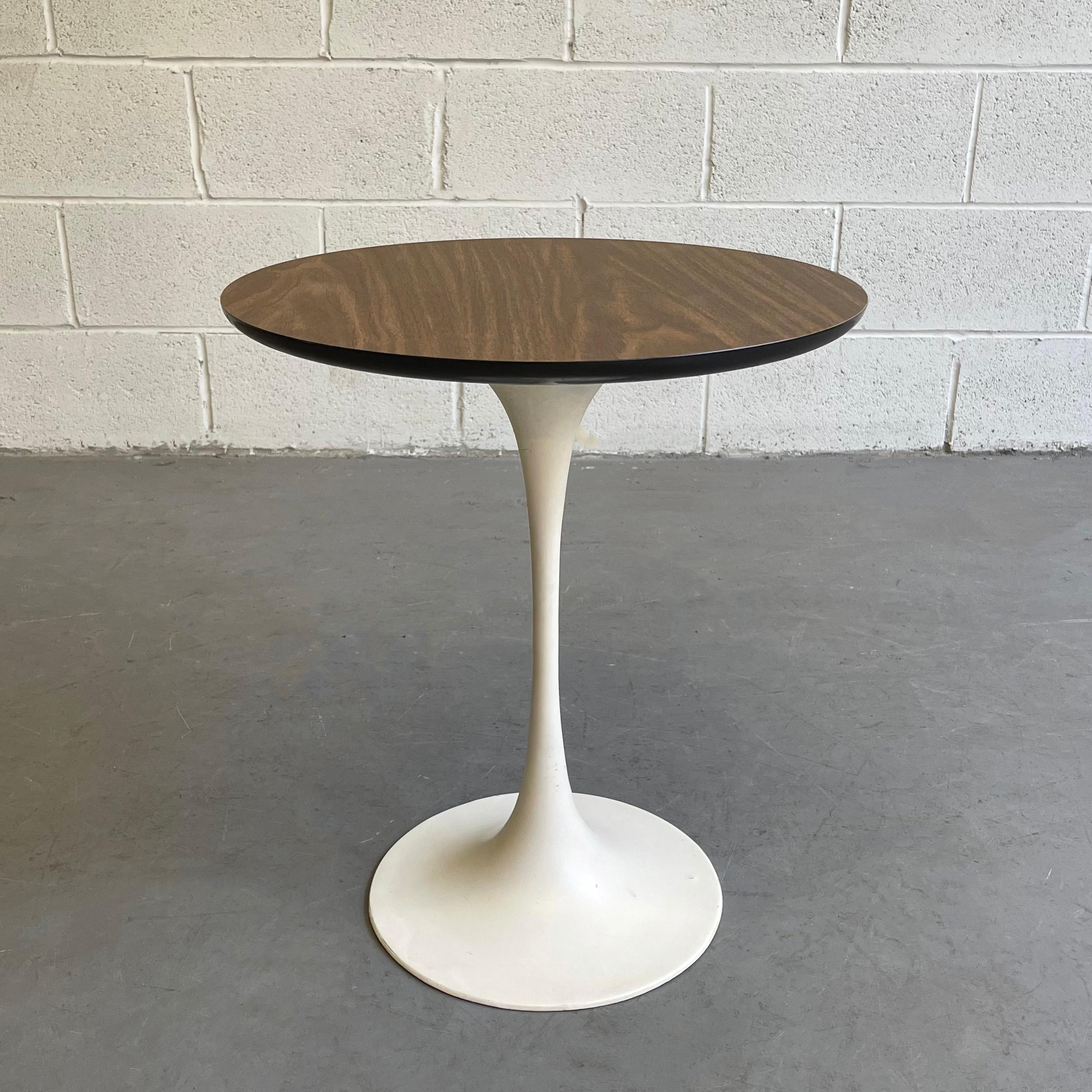 Mid-Century Modern, side table by Eero Saarinen for Knoll features a painted metal tulip pedestal base with laminate wood top.
