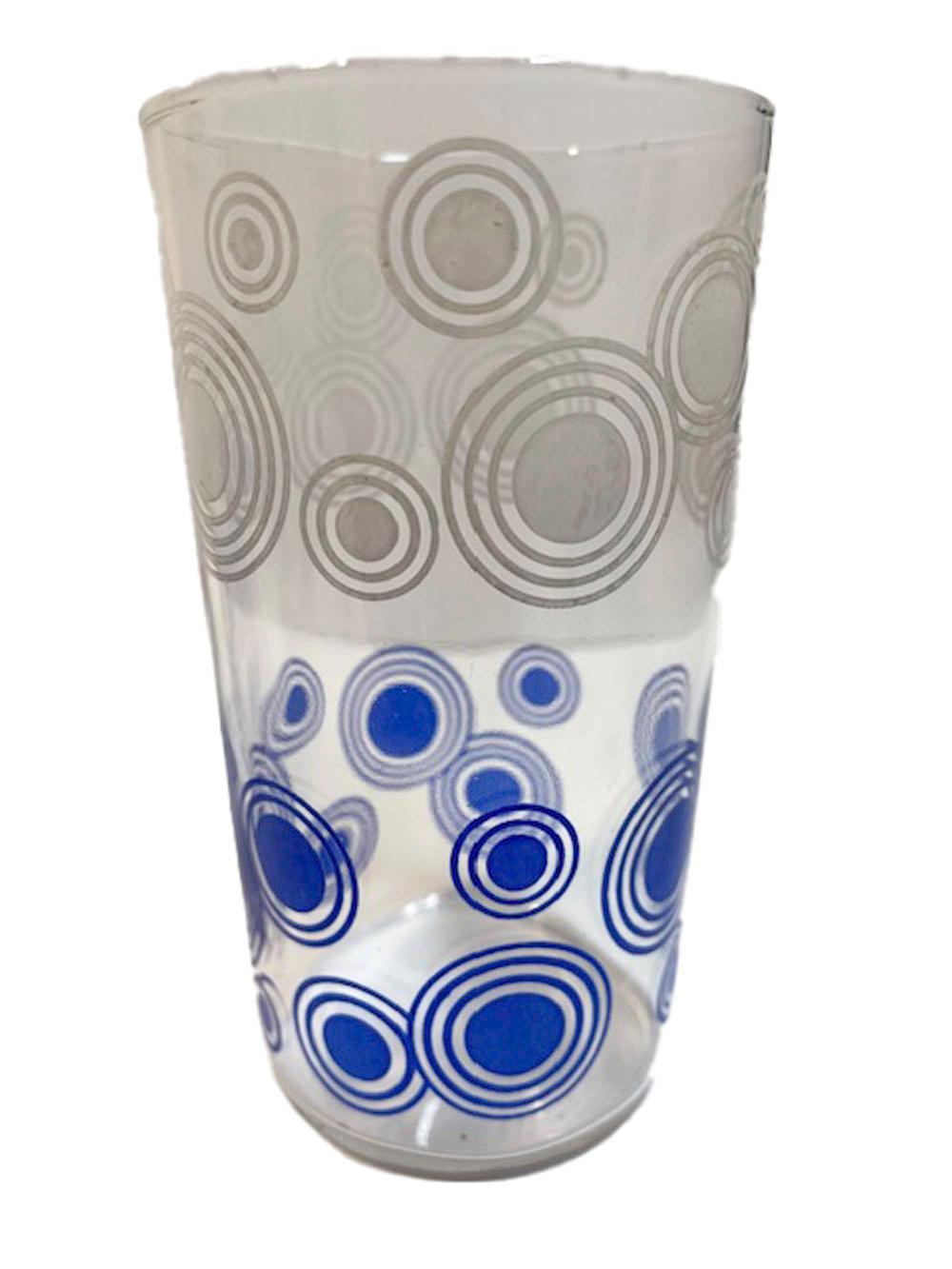 Set of 8 Libbey cocktail glasses decorated with dots enclosed in concentric circles, the top half of the glasses in white above blue on the lower half.