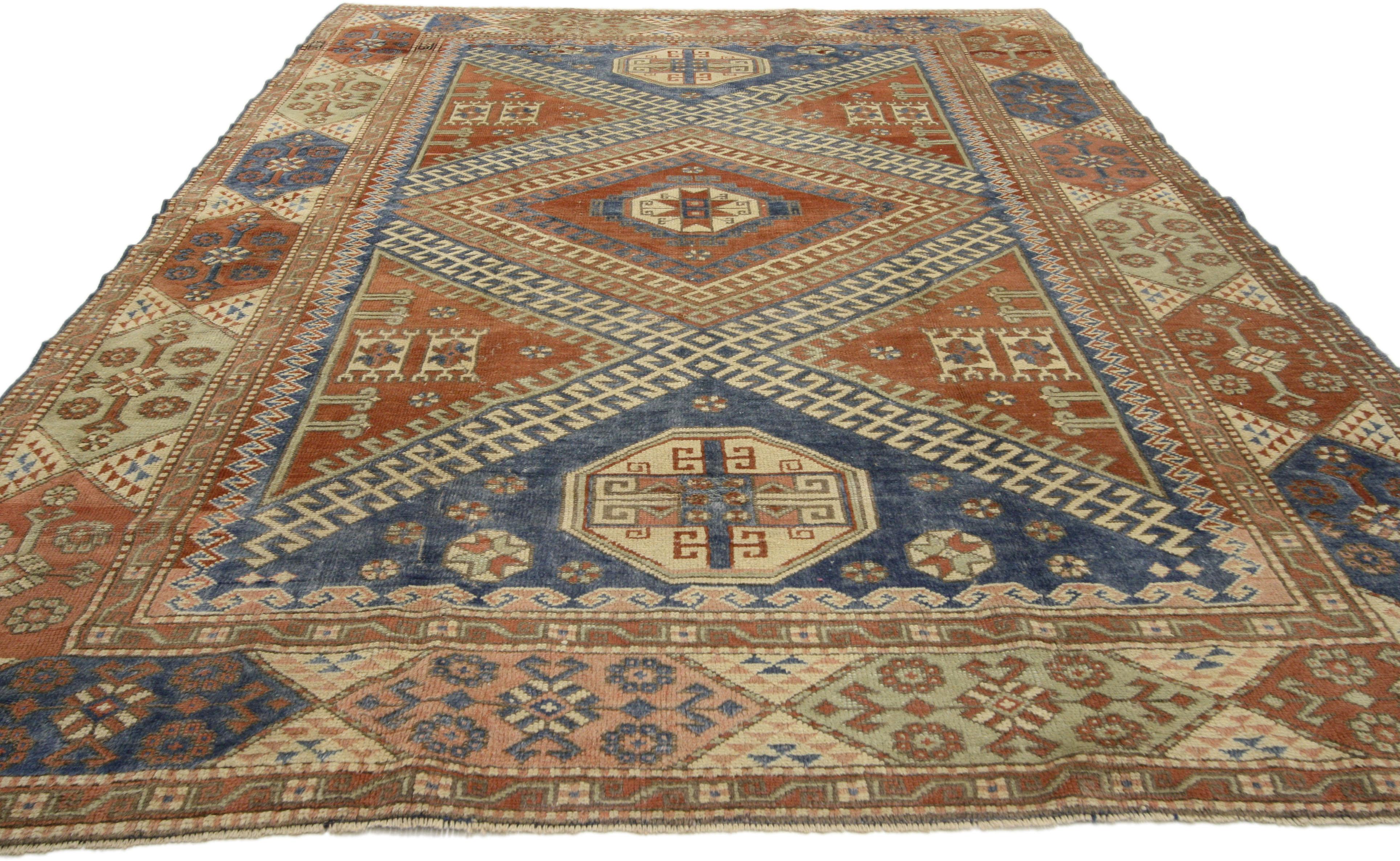 51177 Mid-Century Modern Vintage Turkish Bergama Rug with Nomadic Tribal Style. With its time softened colors and bold elemental nature, this eccentric mid-20th century vintage Turkish Bergama rug embodies true rectilinear style composed of 