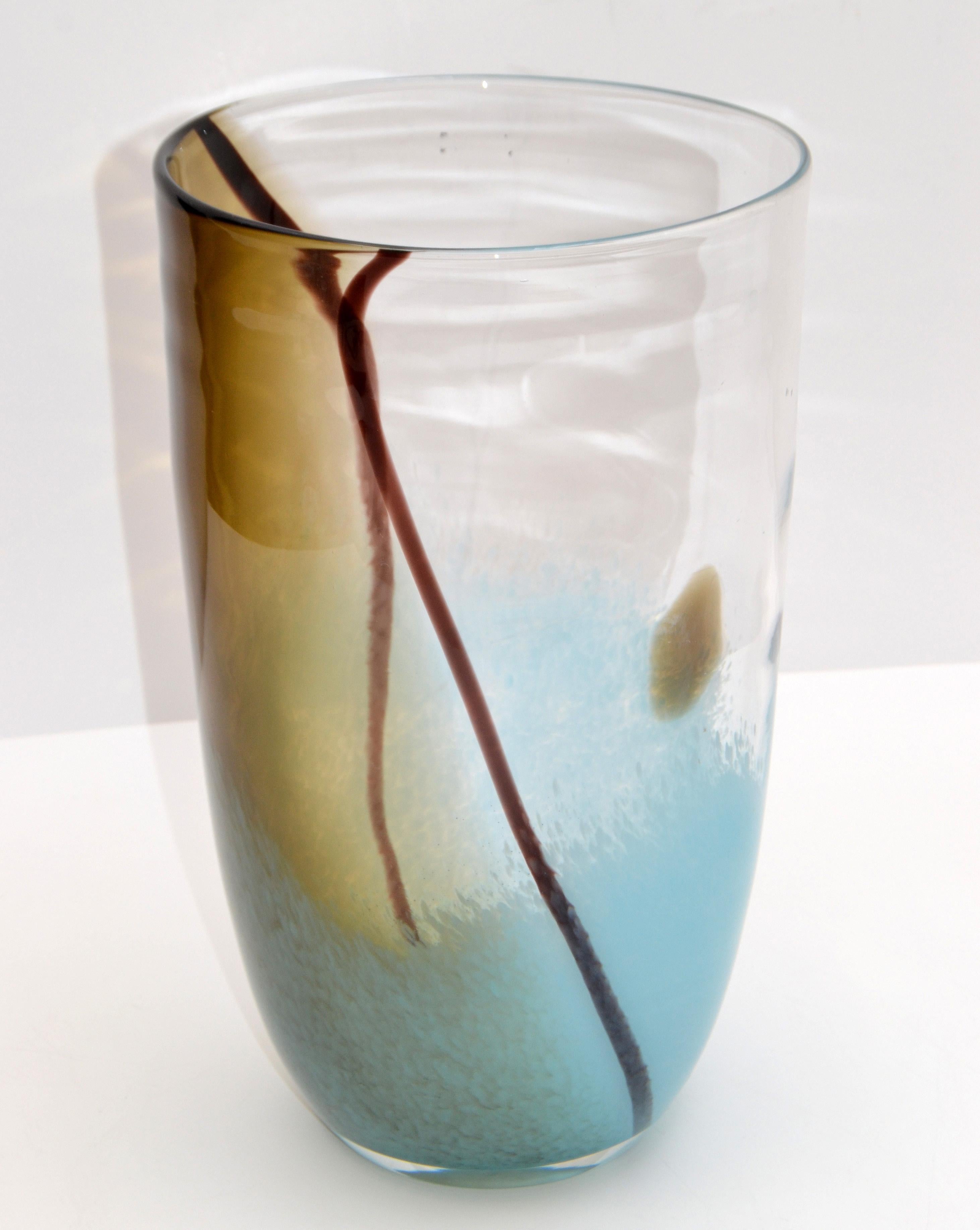 Elegant Mid-Century Modern hand blown Murano art glass vase in turquoise, brown and clear colors.
Made in Italy in the late 1970s.
Simply lovely.