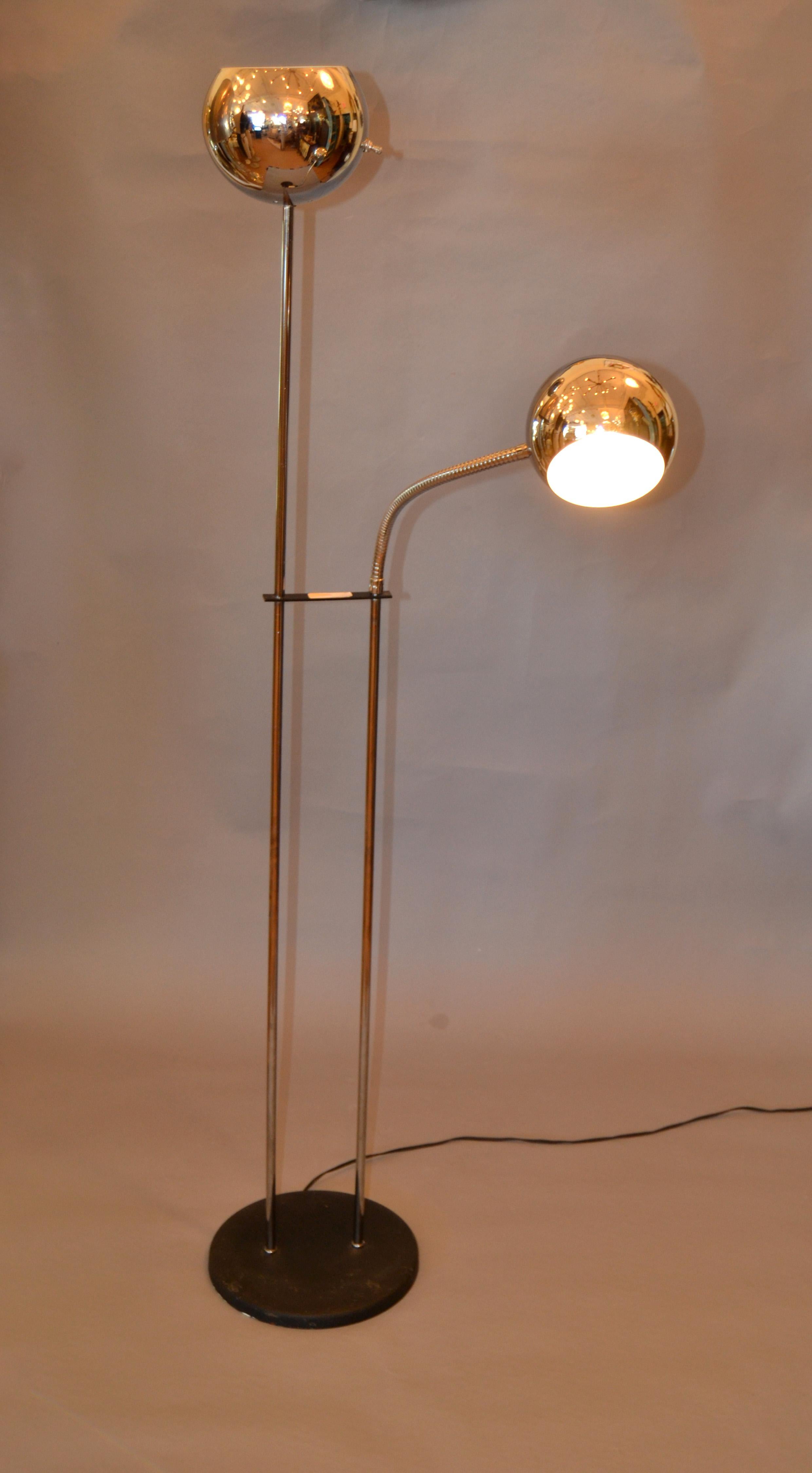 We offer this adjustable floor lamp which has two chrome ball shade lights mounted on a black metal base.
One light is adjustable the other one is stationary.
Both Lights can be operated individually to allow for use as a reading, and or