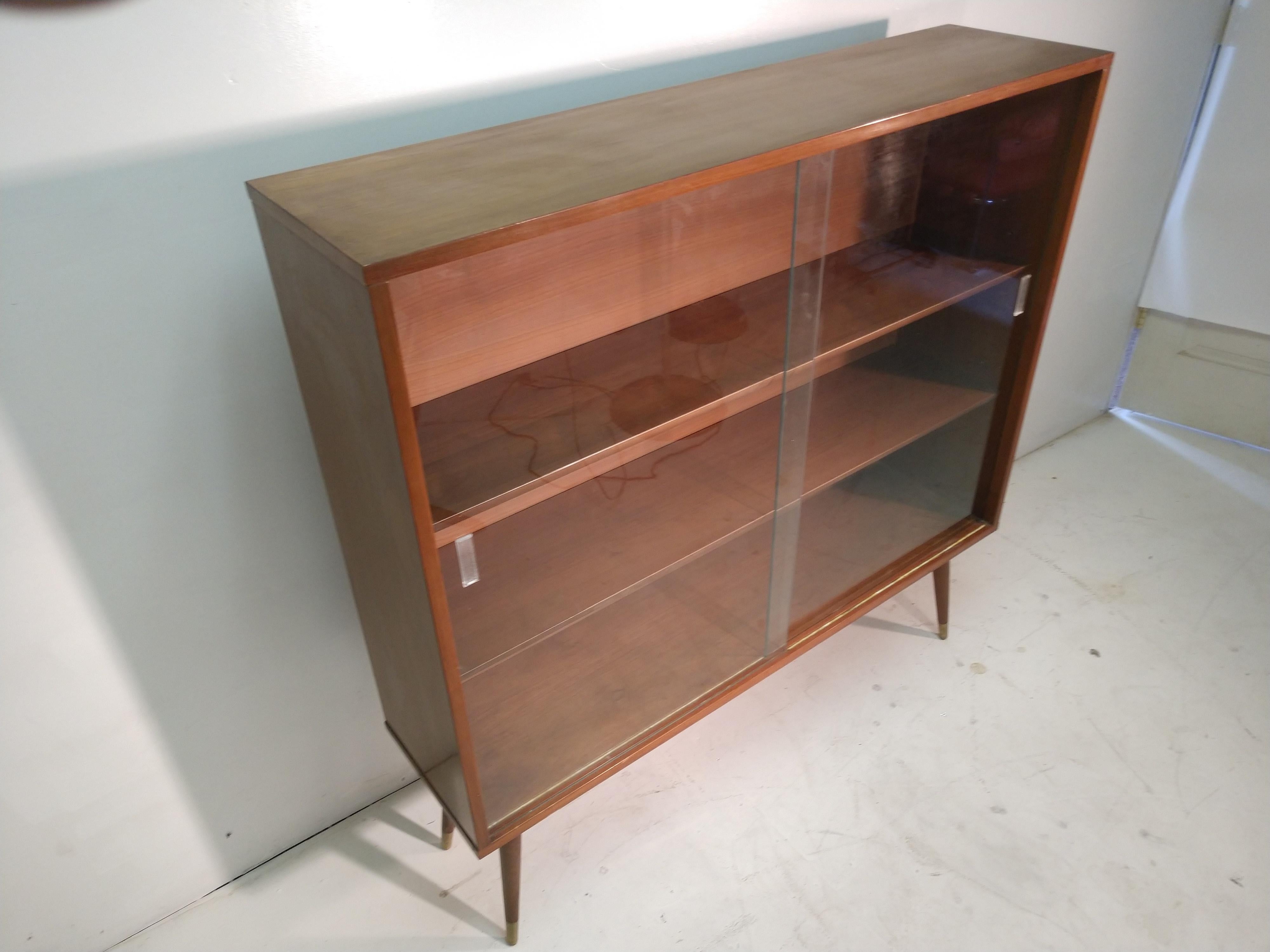 mid century modern bookcase with glass doors