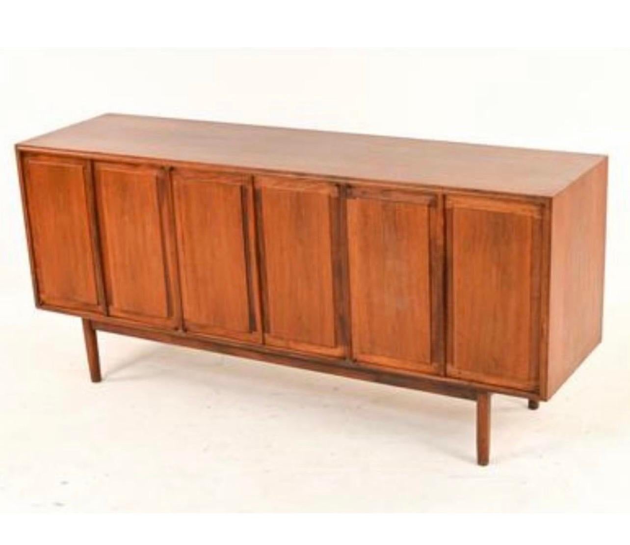 Iconic two-piece teak and walnut midcentury credenza where the top piece can float over the bottom piece or sit on top as we have photographed. The measurements below show height as measured with the top piece resting on top.
The height of the