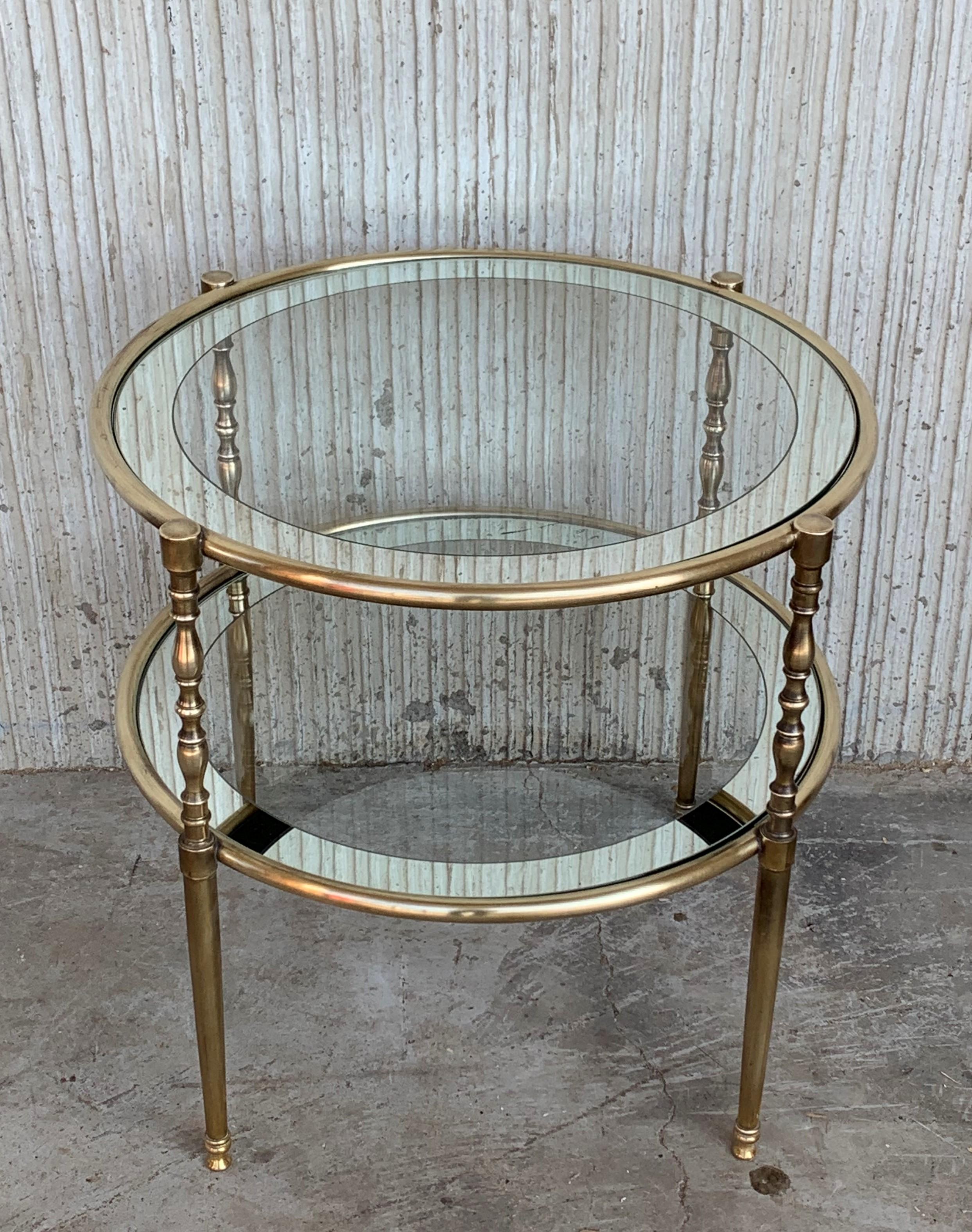 Mid-Century Modern two-tier brass and mirror beveled glass side table in Maison Jansen style with fluted brass legs and foot.