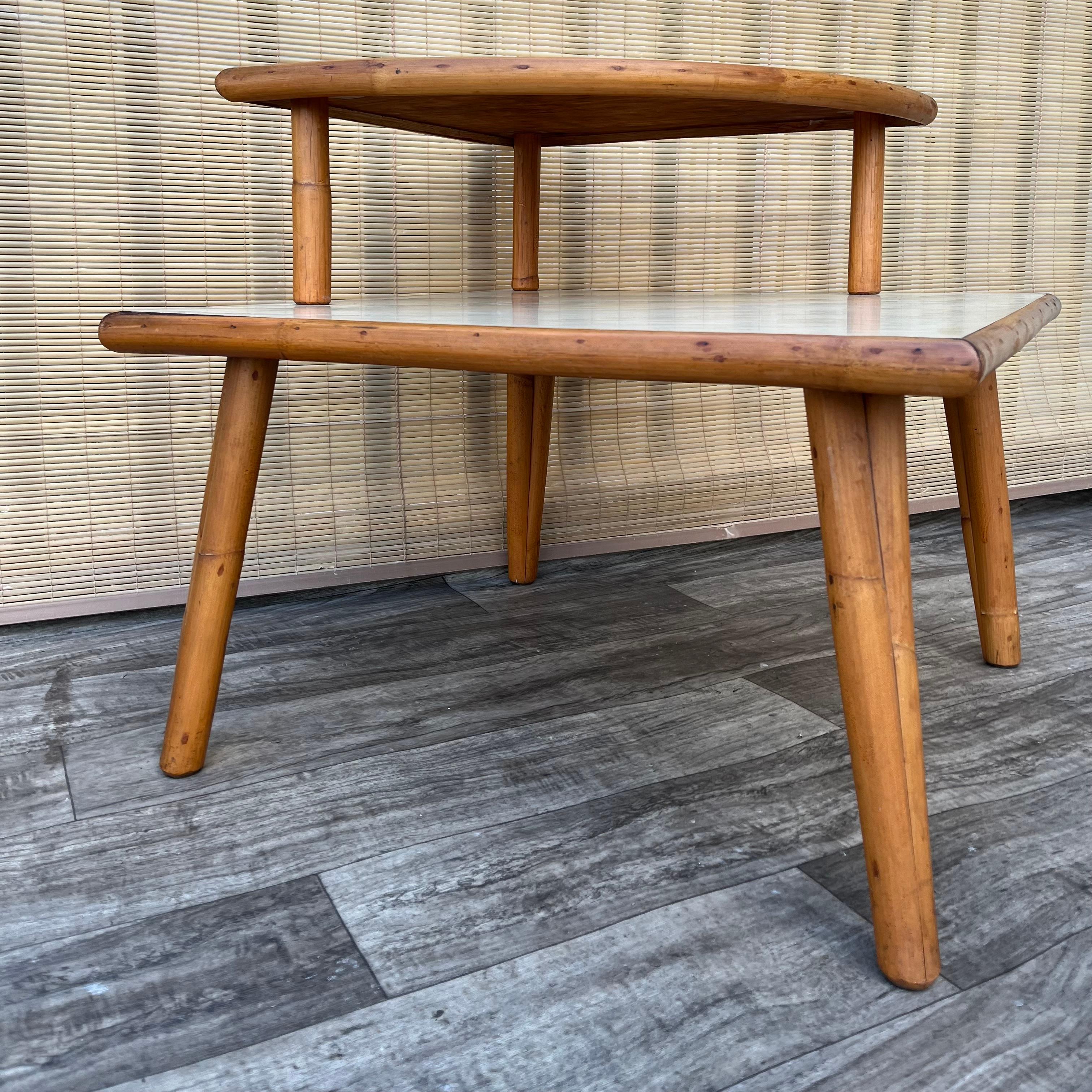 Laminated Mid Century Modern Two Tiered Rattan Corner Table. Circa 1950s For Sale