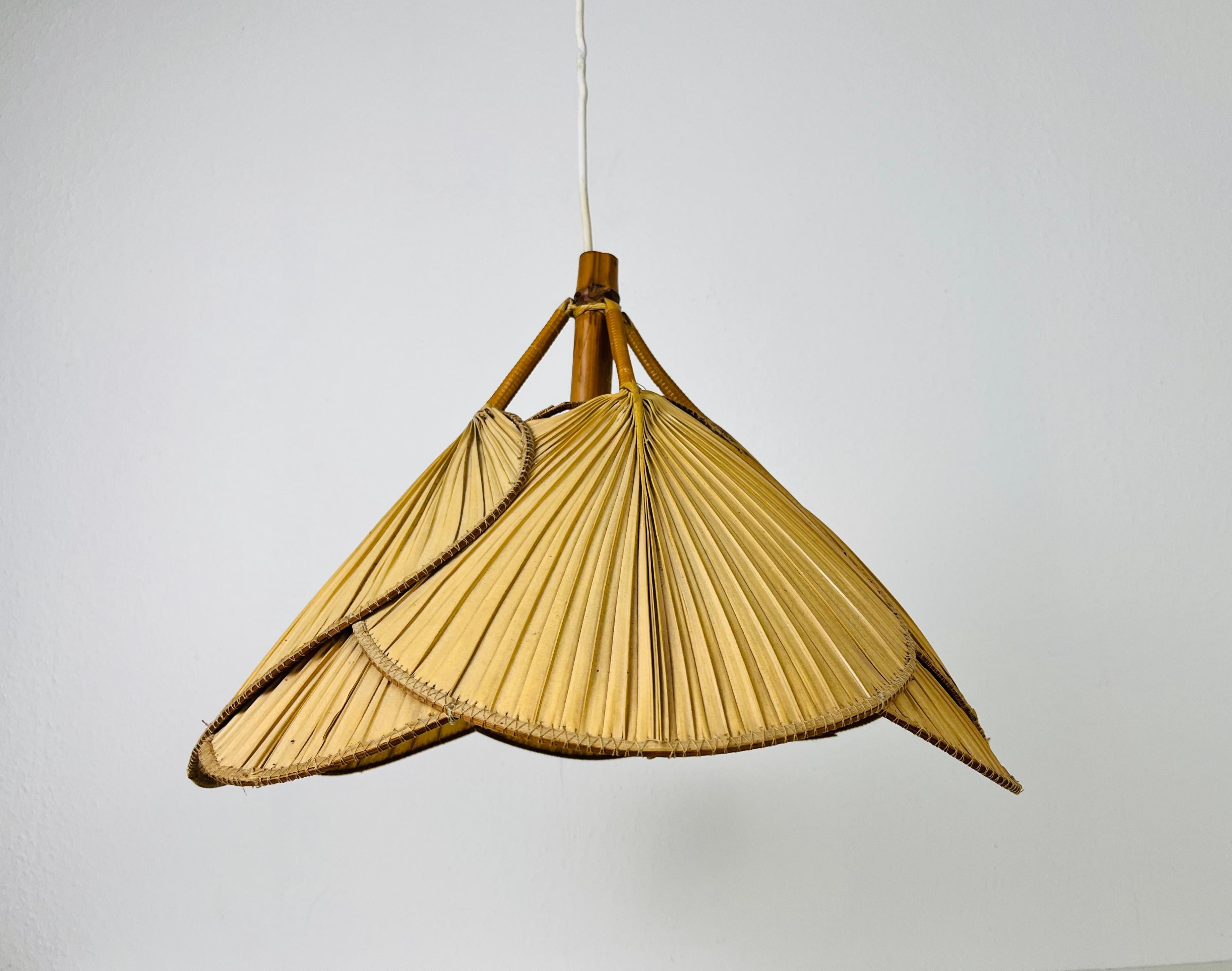 Iconic pendant lamp in the style of Ingo Maurer made in the 1960s. The lighting is made of bamboo and thin paper. It gives beautiful natural light.

Dimensions
height: 31-90 cm
diameter: 48 cm

The light requires one E27 (US E26) light bulb.